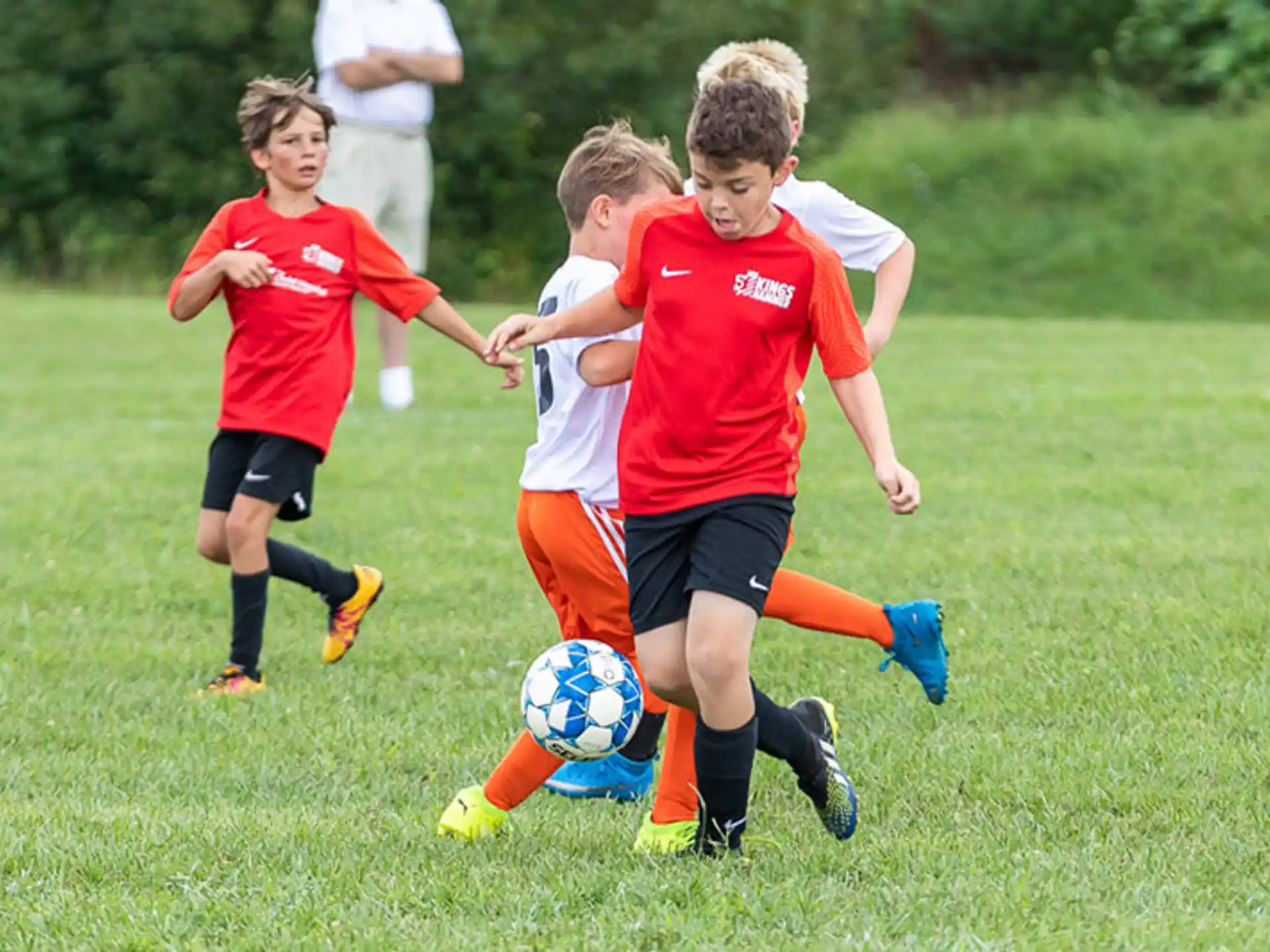 a group of kids playing football