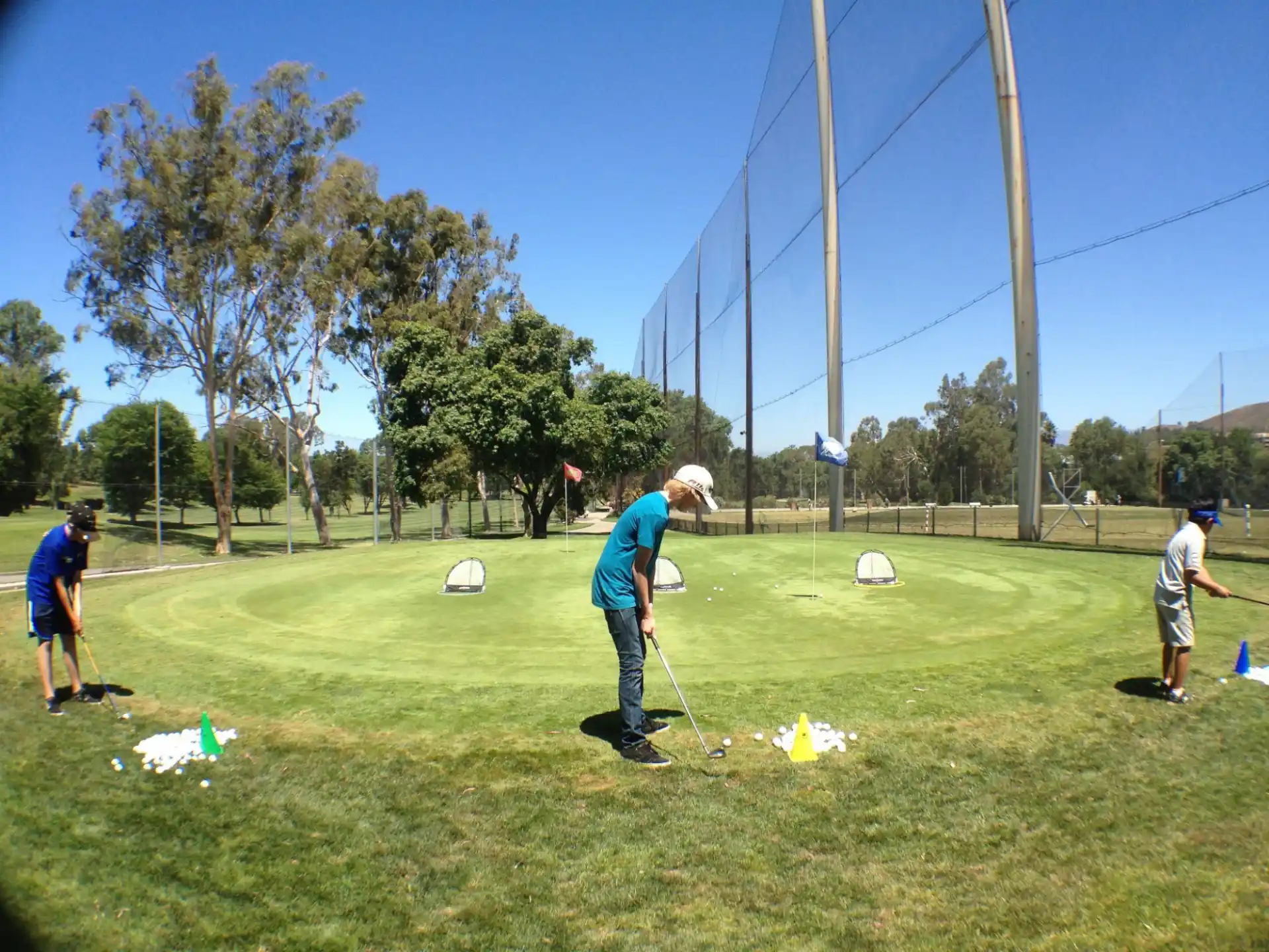 a group of people playing golf