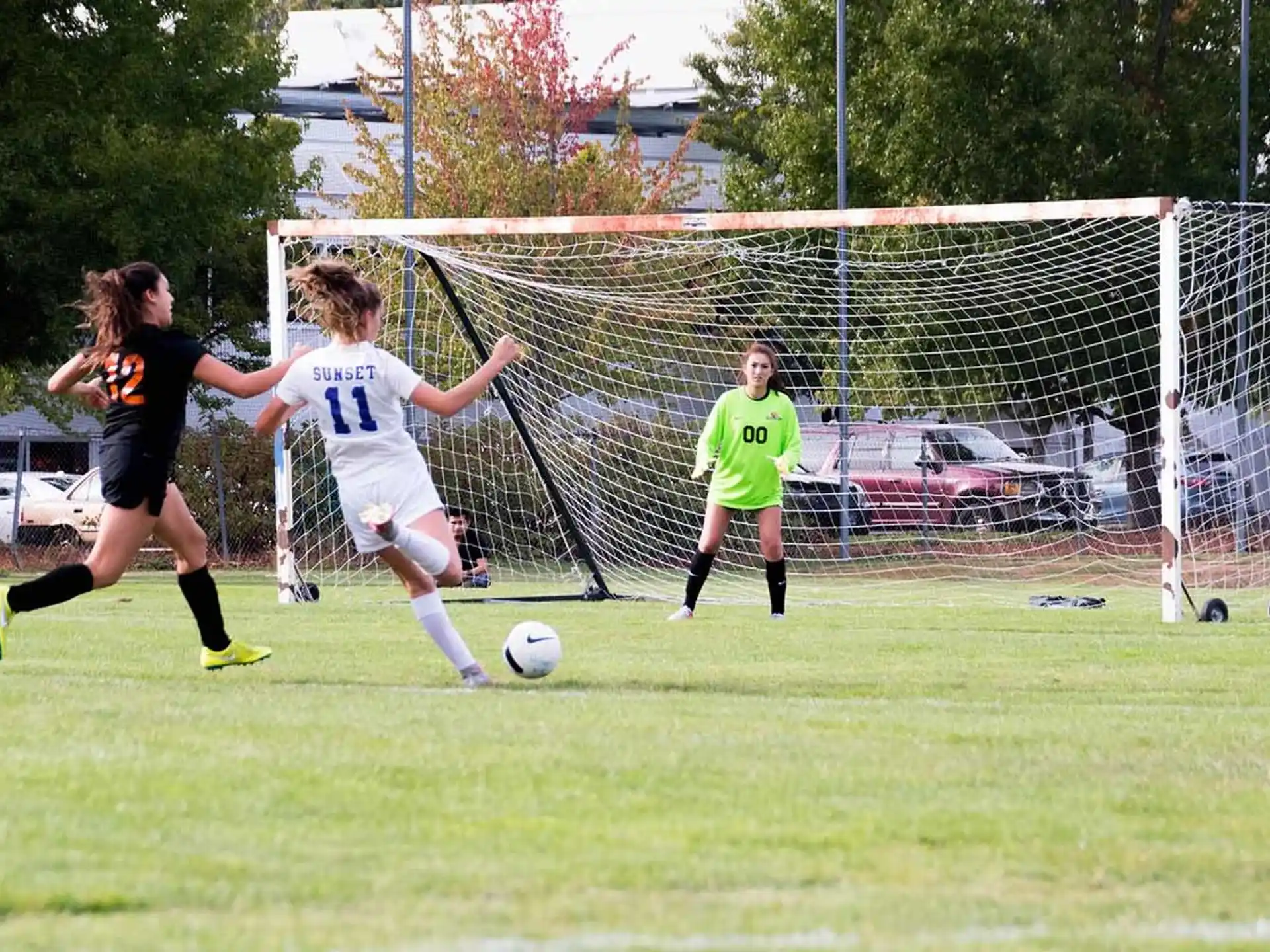 girls playing football on a field