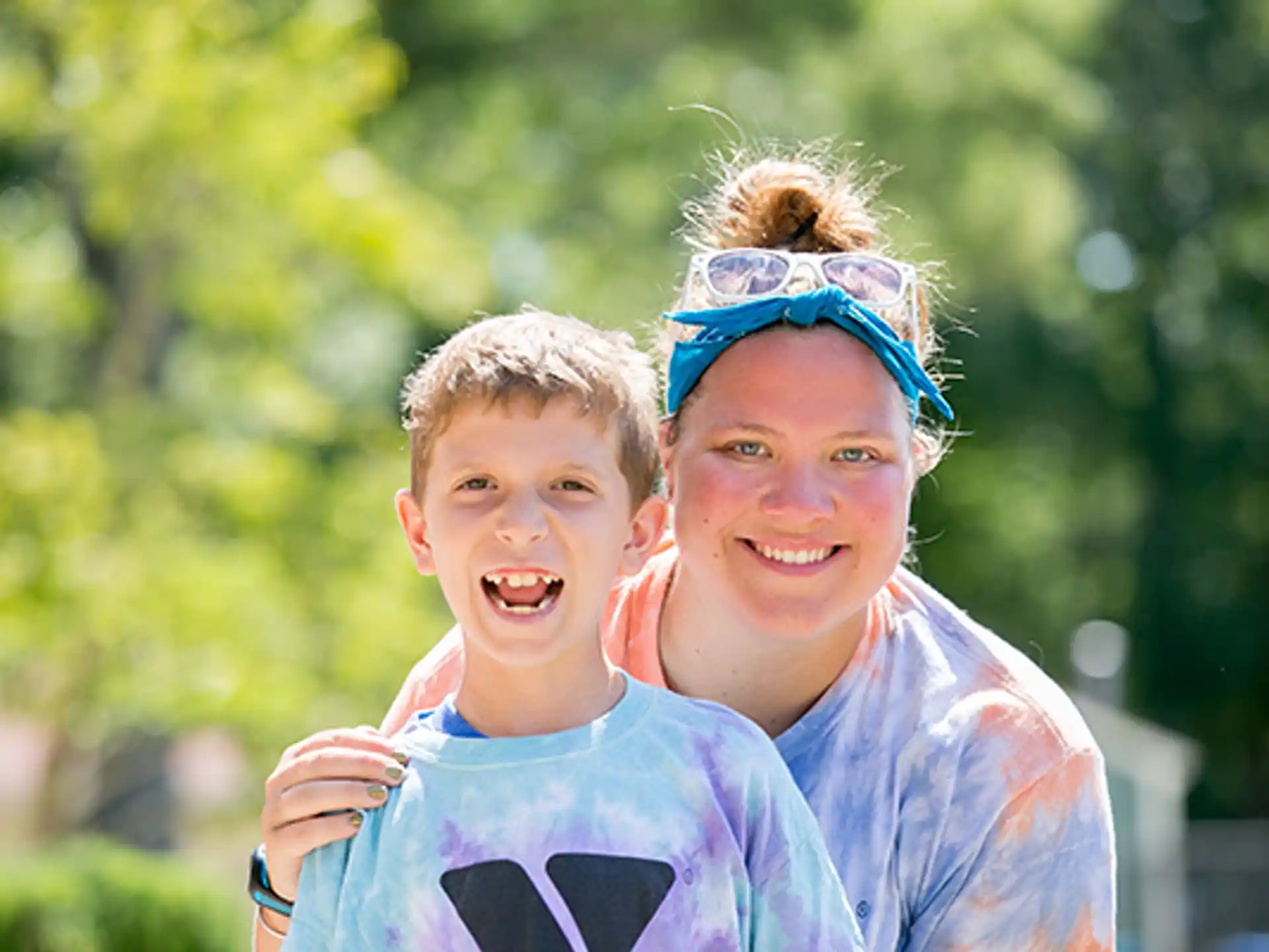 a person and a boy with paint on their faces