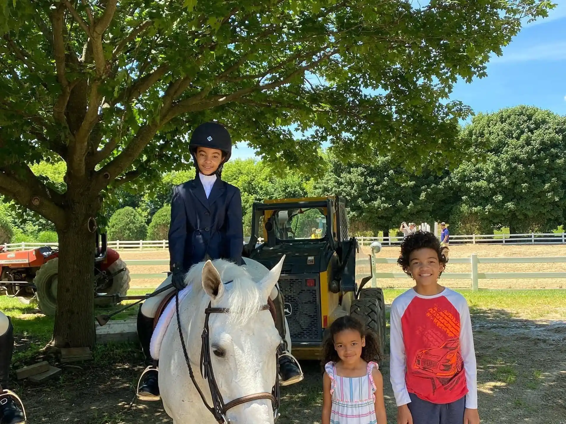 a man on a horse with two children