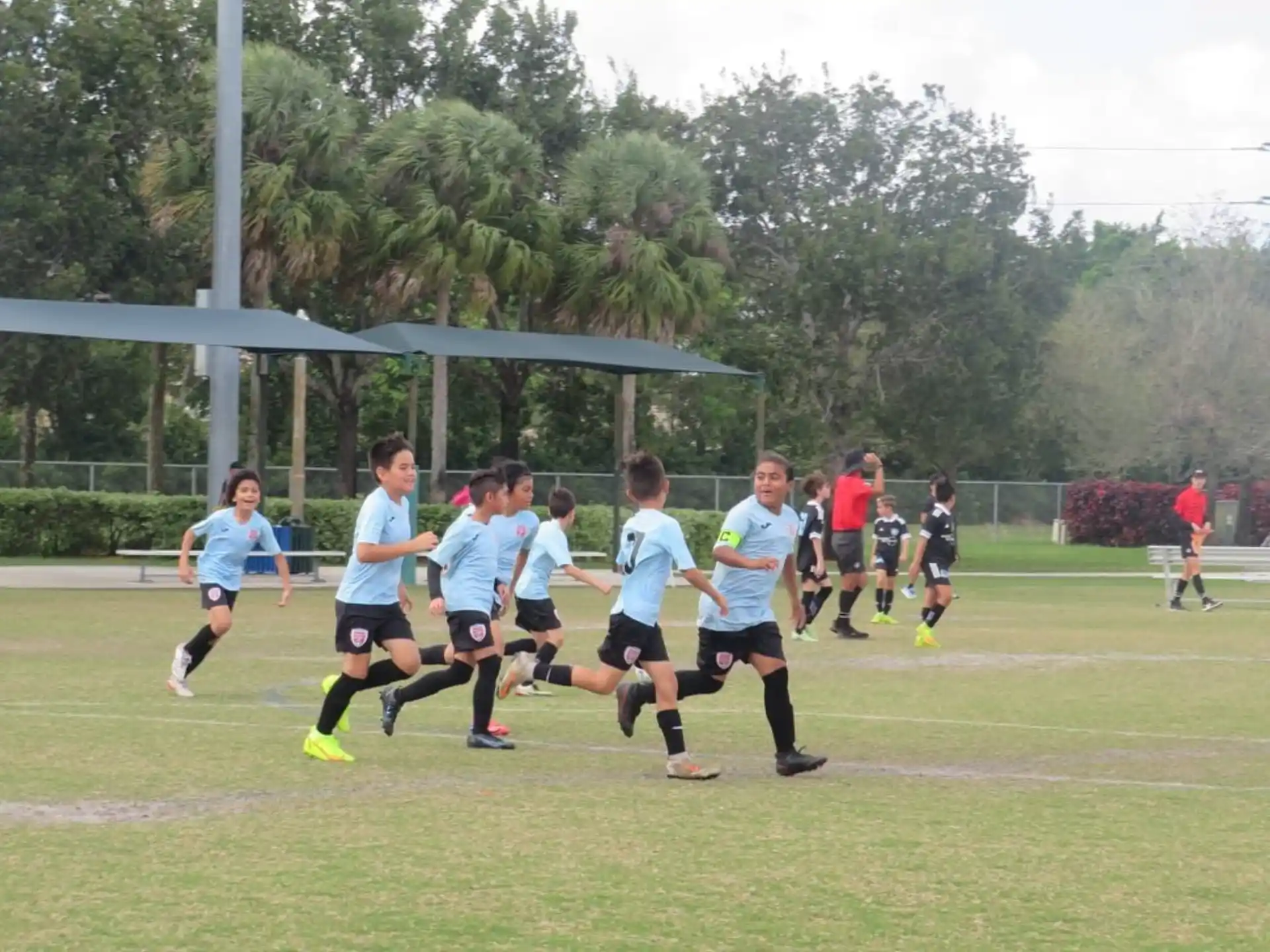 a group of people playing football