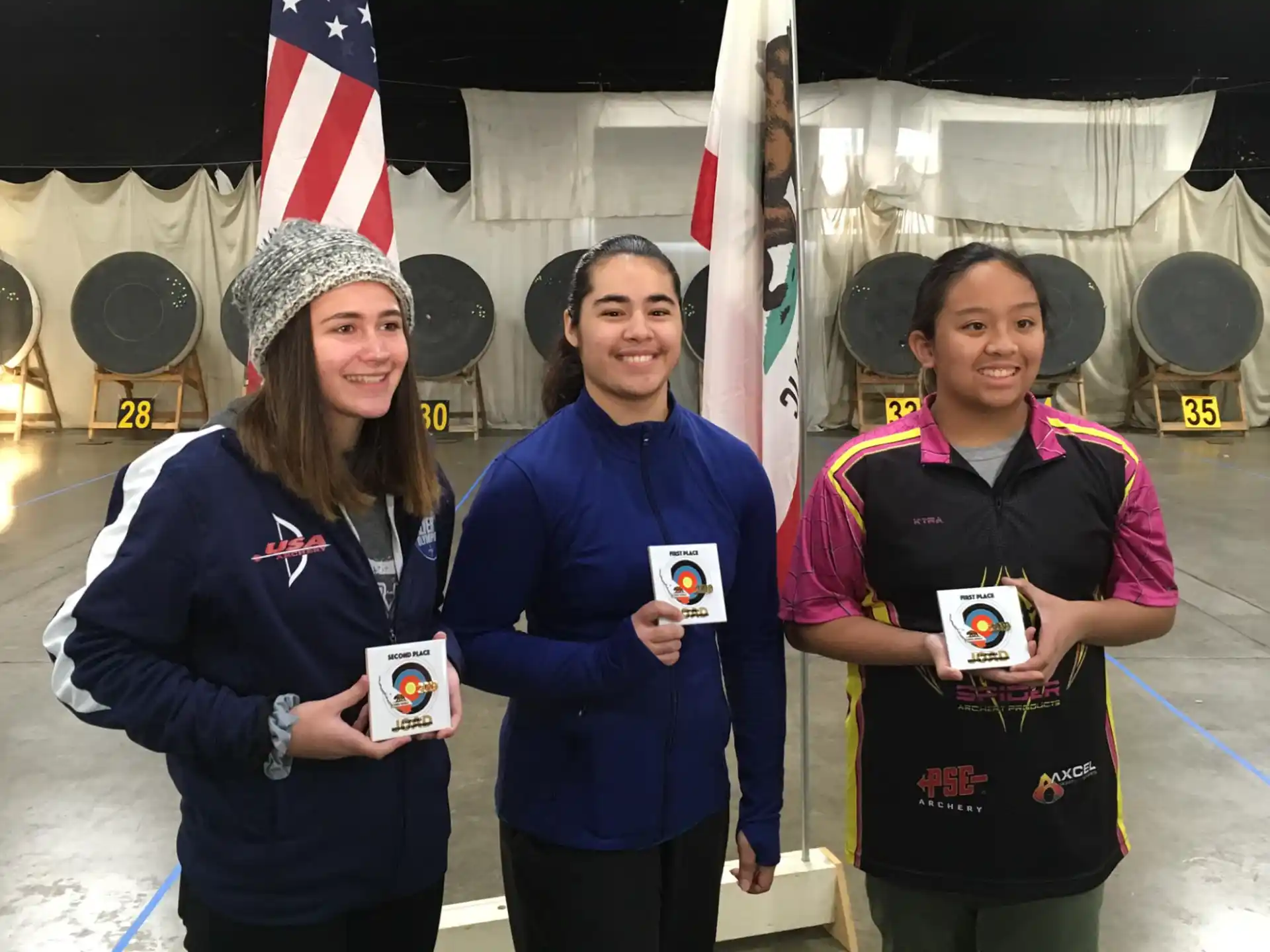 a group of women holding small boxes