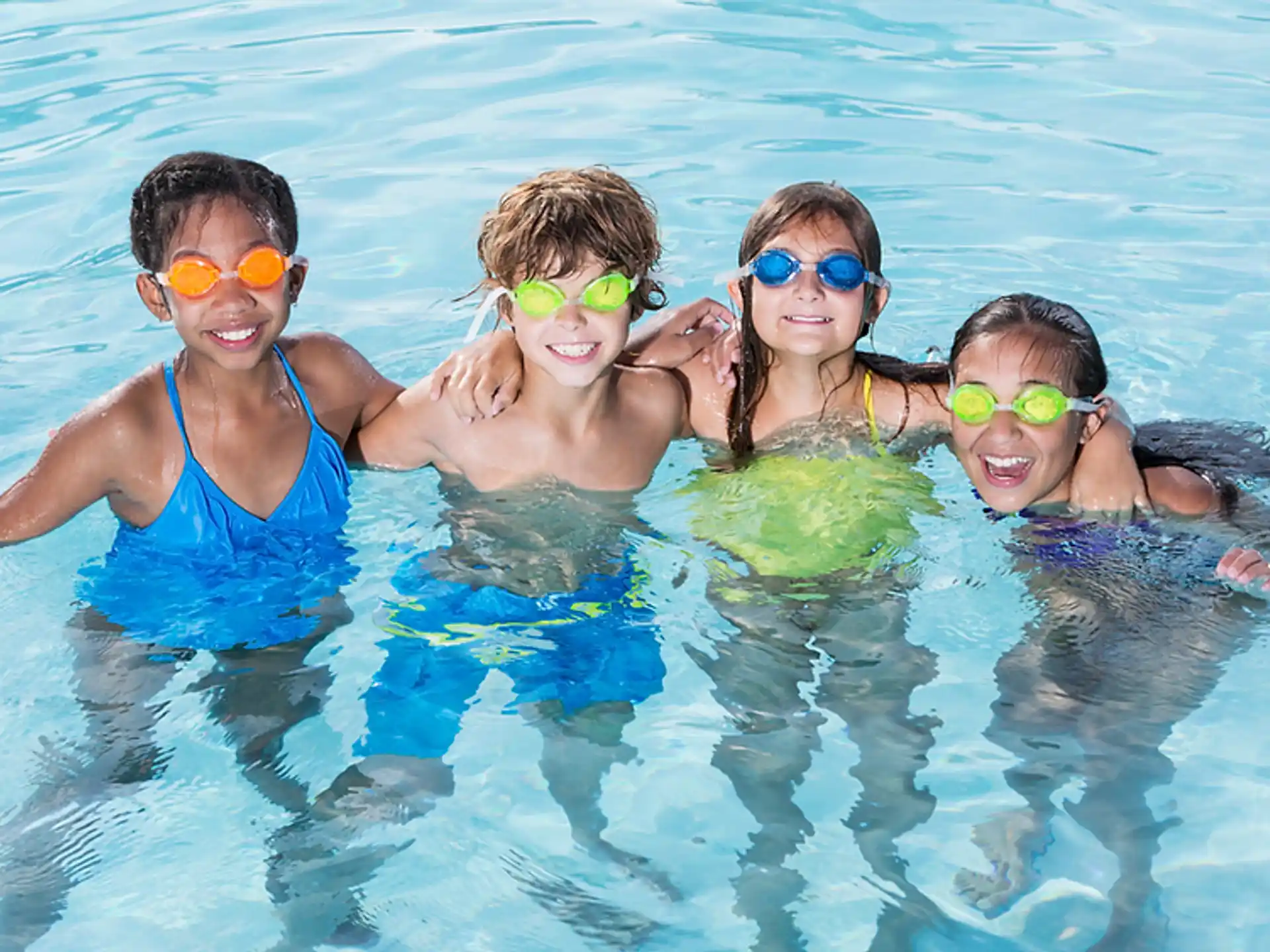 a group of kids in a pool