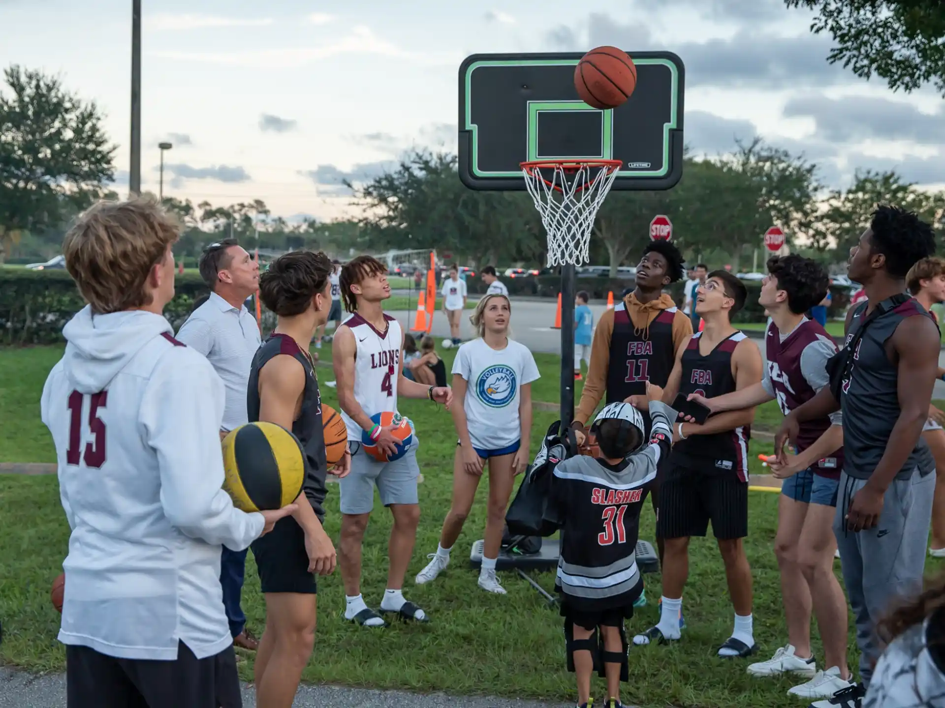 a group of people playing basketball