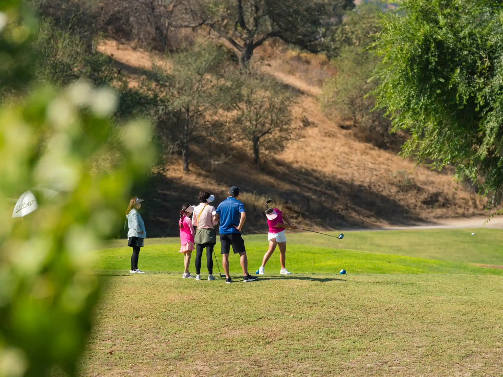 a group of people playing golf