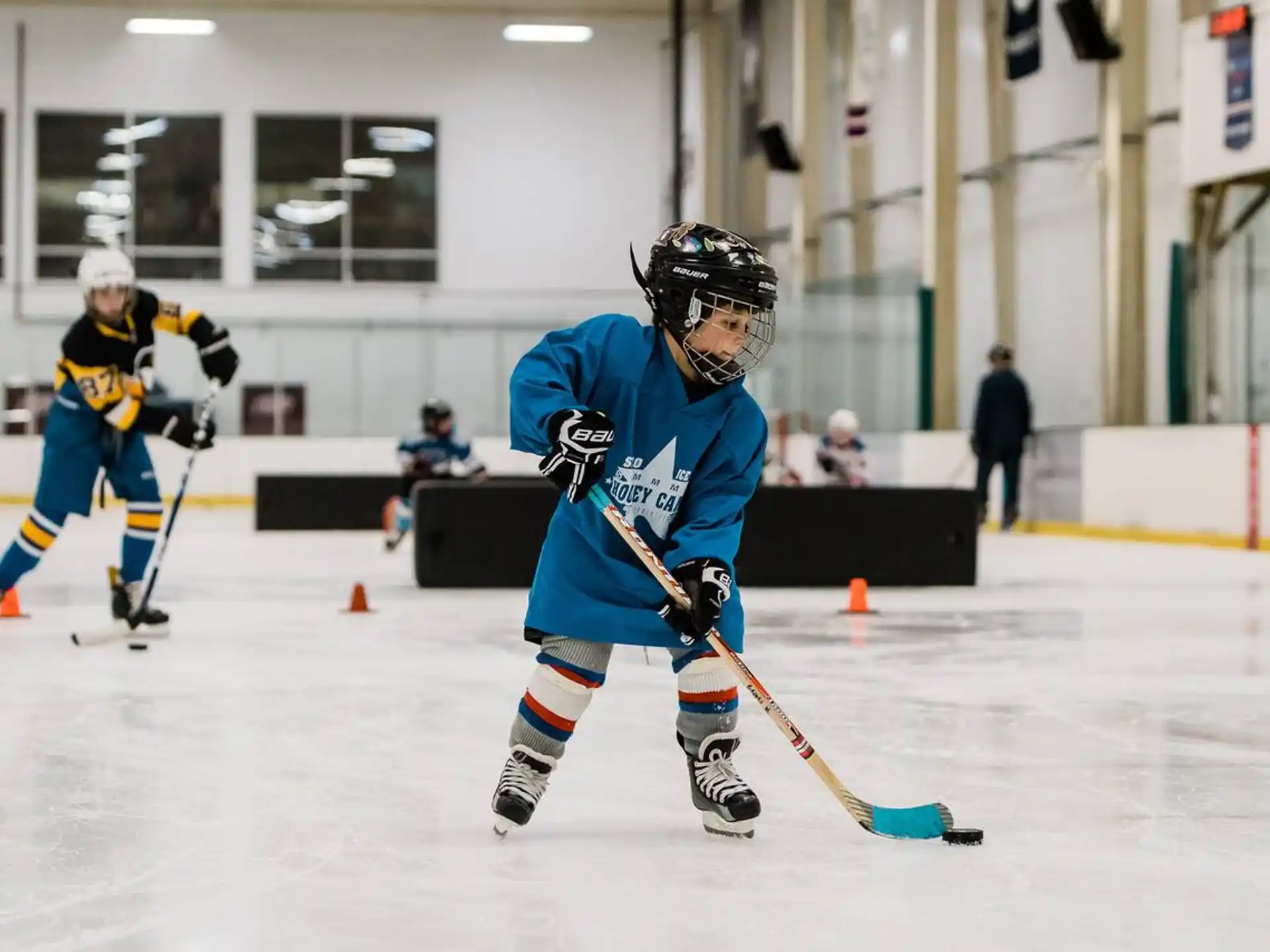 a couple of men playing hockey