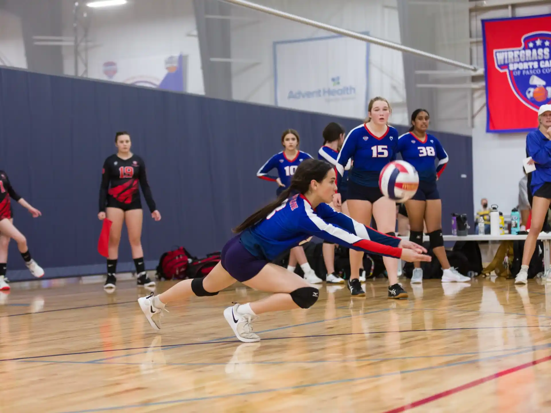 a group of women playing volleyball