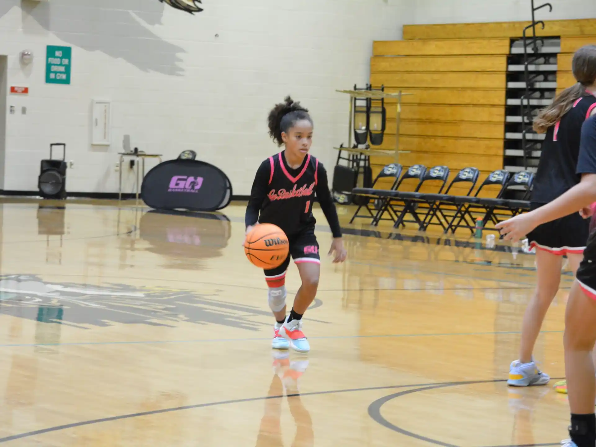 a group of girls playing basketball
