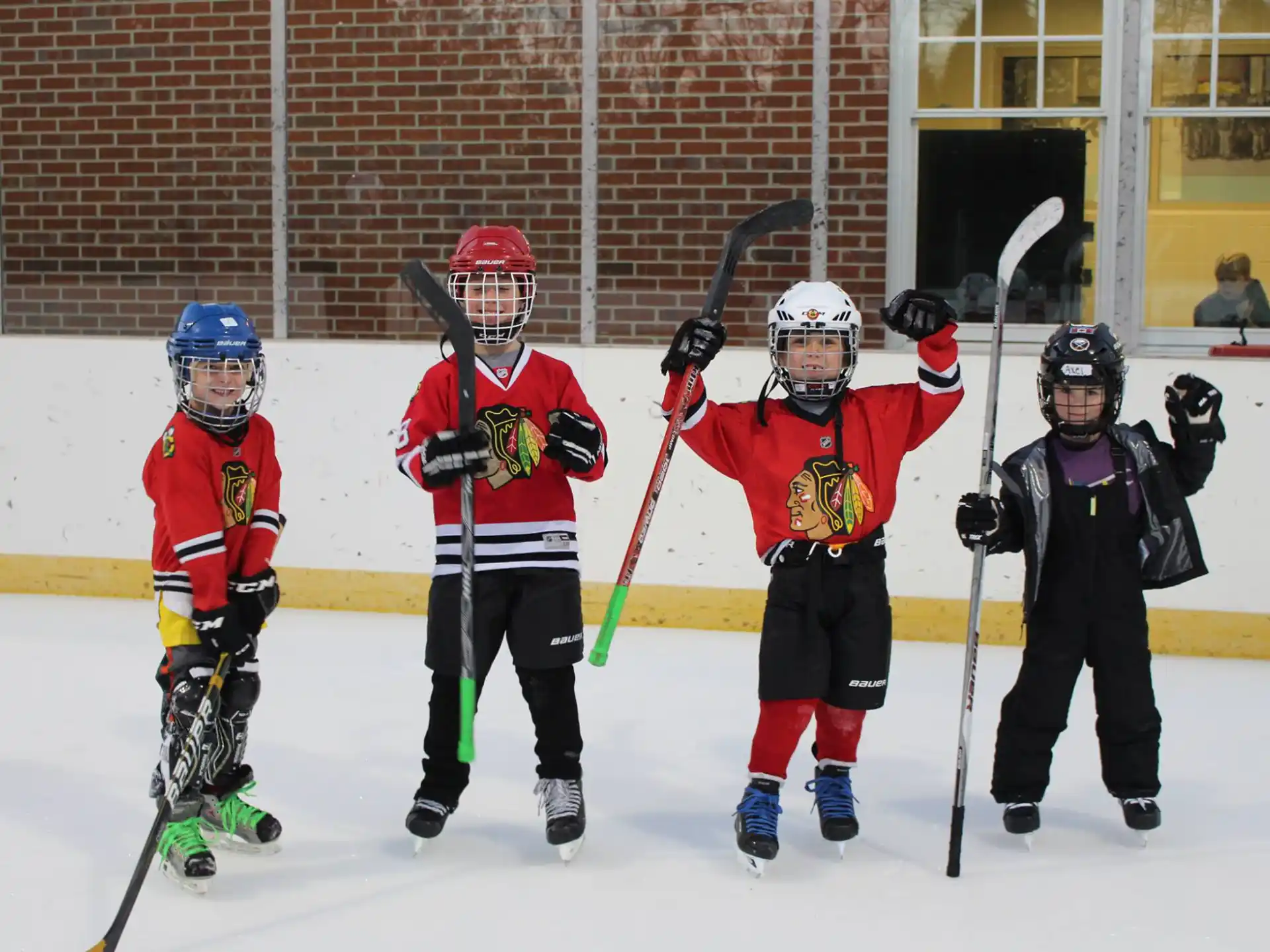a group of kids wearing hockey gear