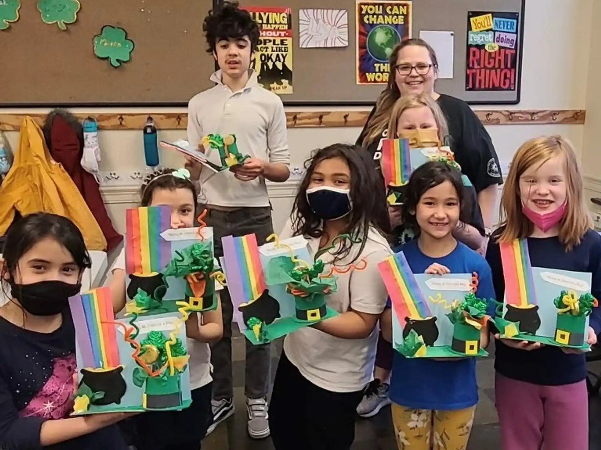 a group of children holding up a sign