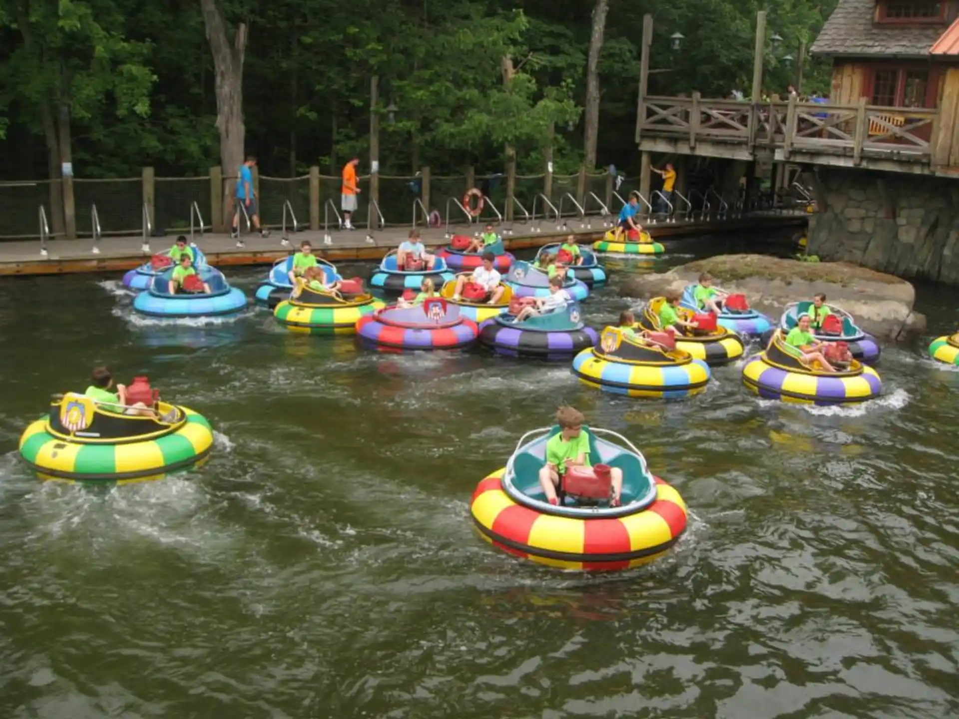 a group of people in inner tubes on a river