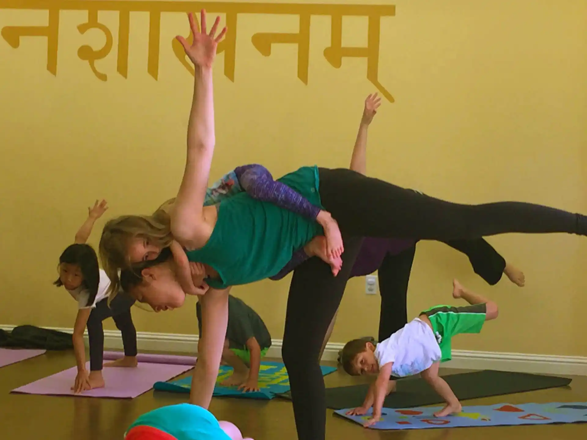 a group of children doing yoga