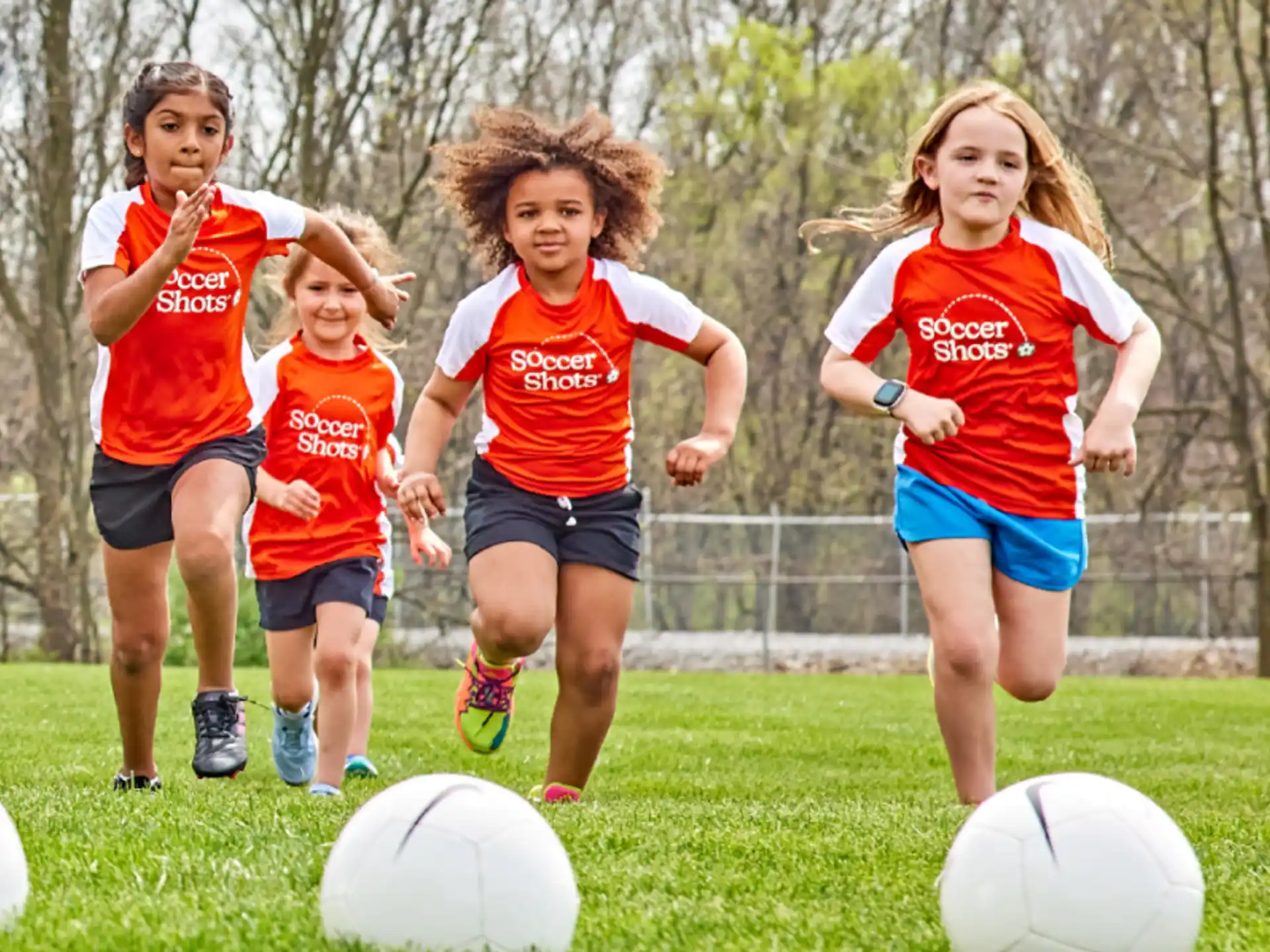 a group of girls playing football