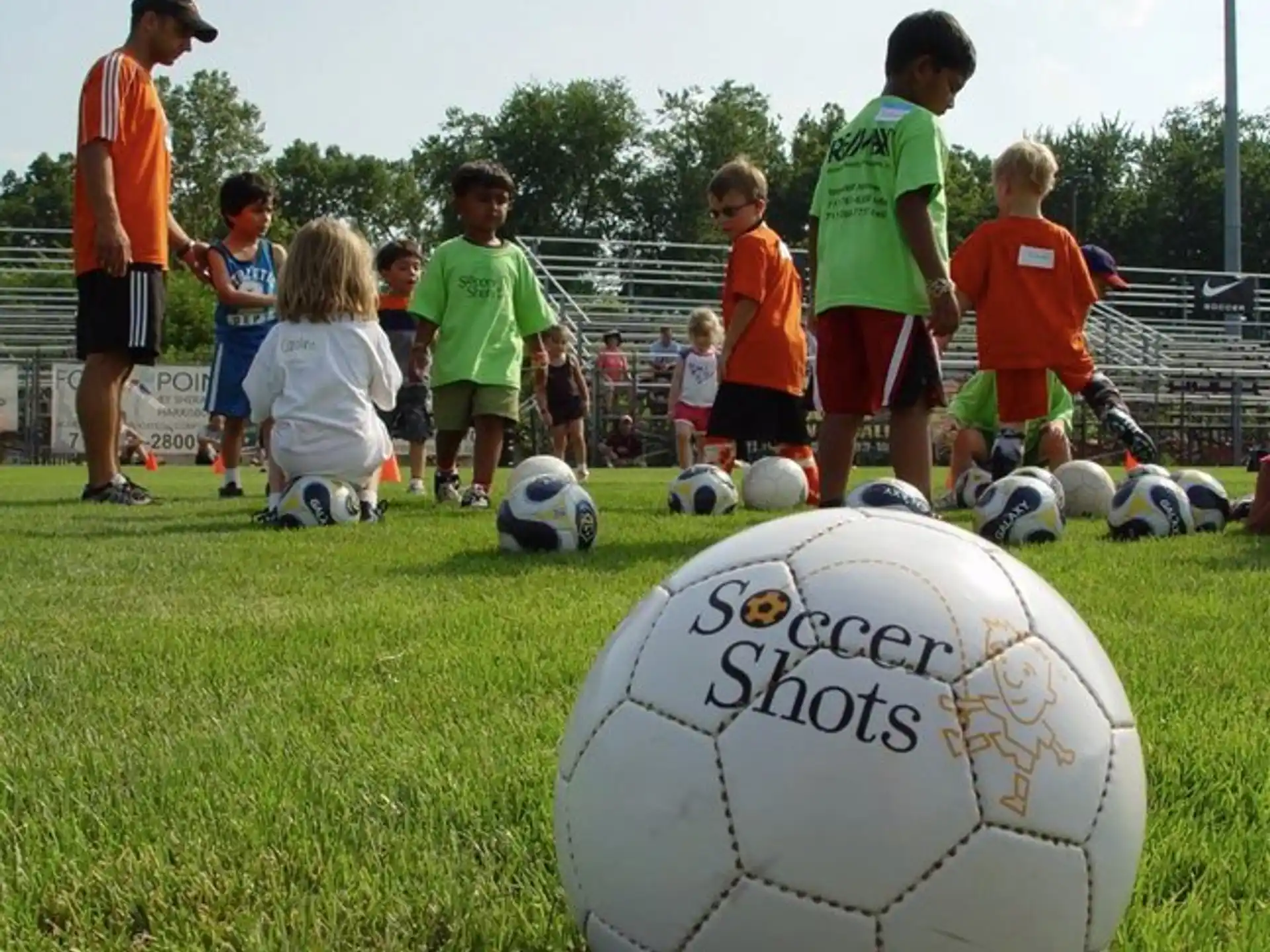a group of kids playing football