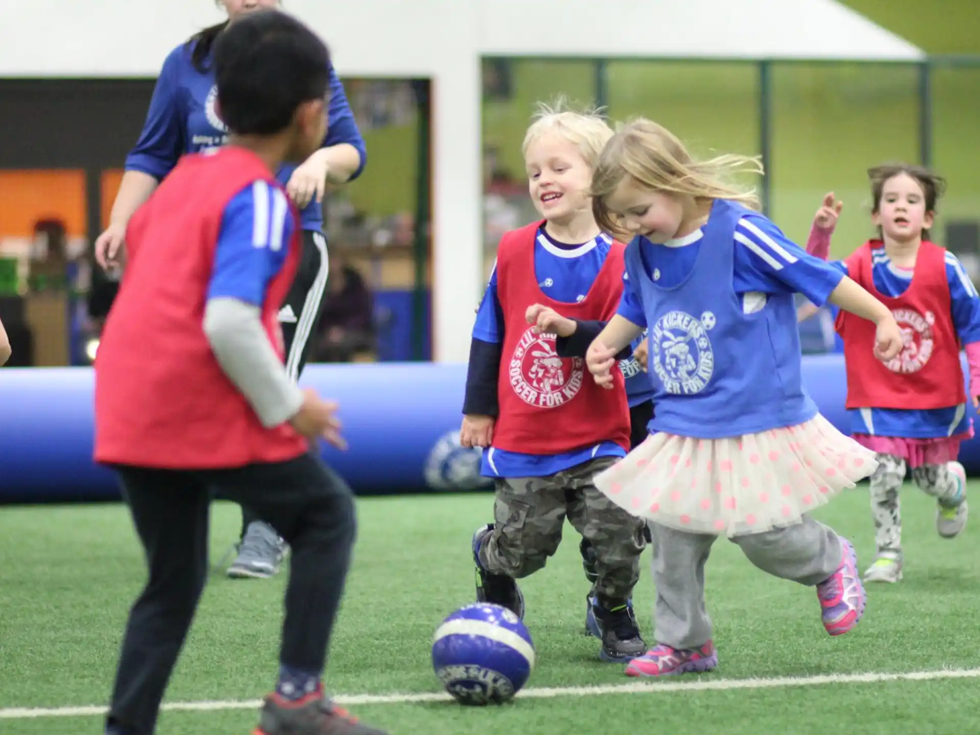 a group of kids playing football