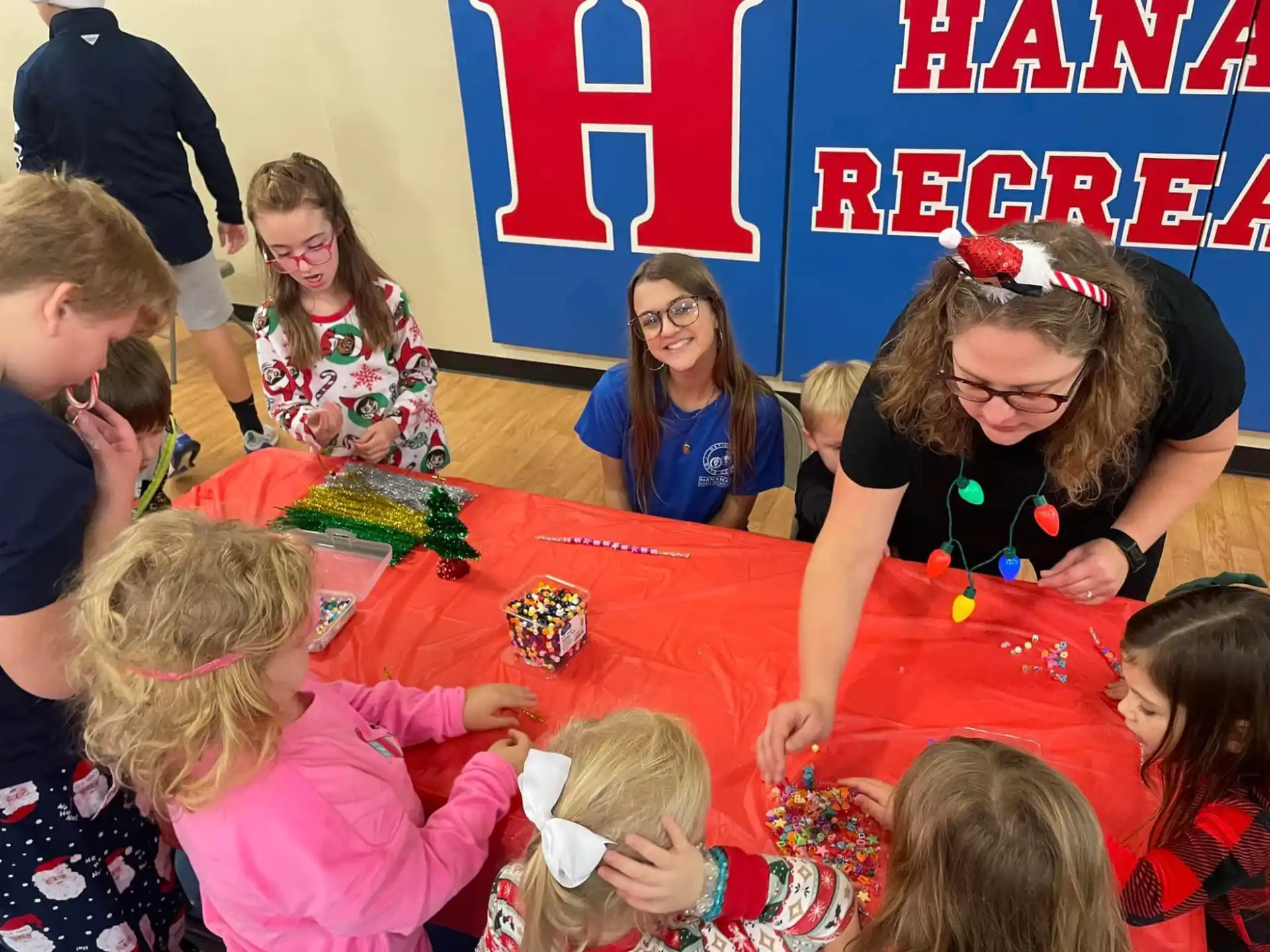 a group of children sitting around a table