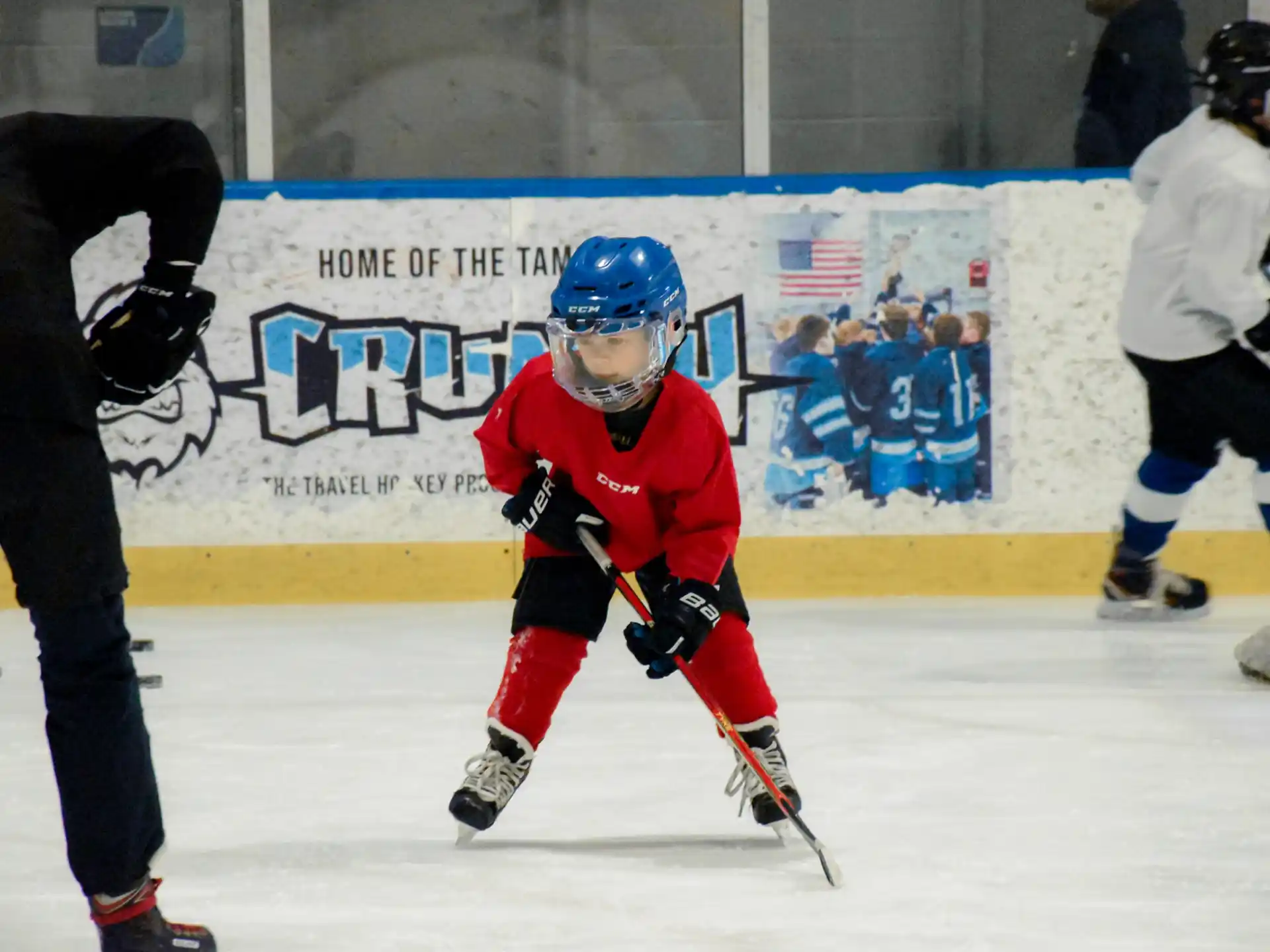 a young boy playing hockey