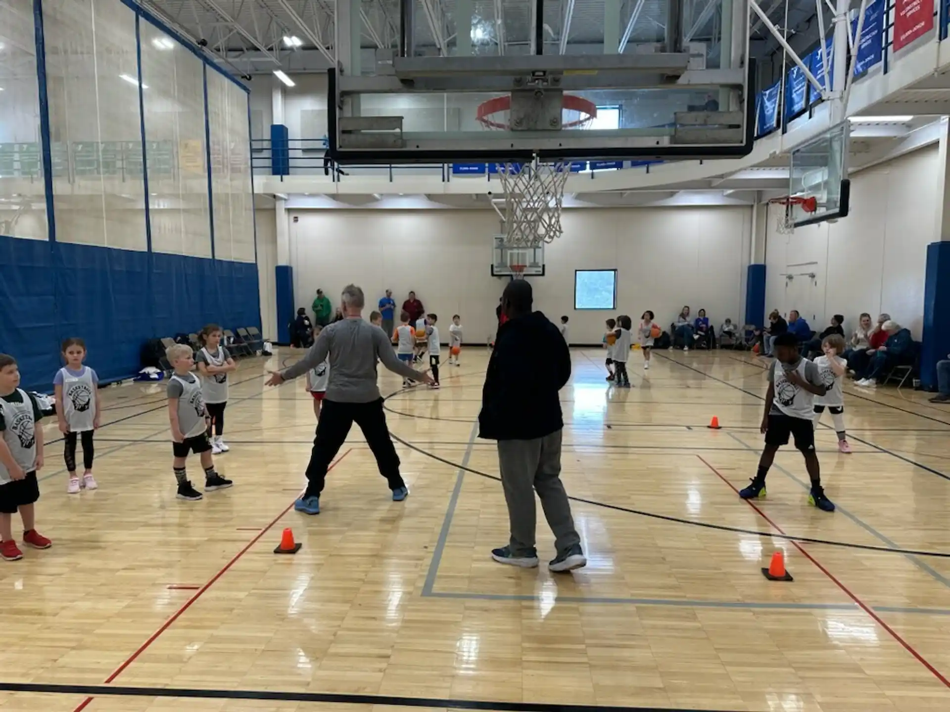 a group of people playing basketball