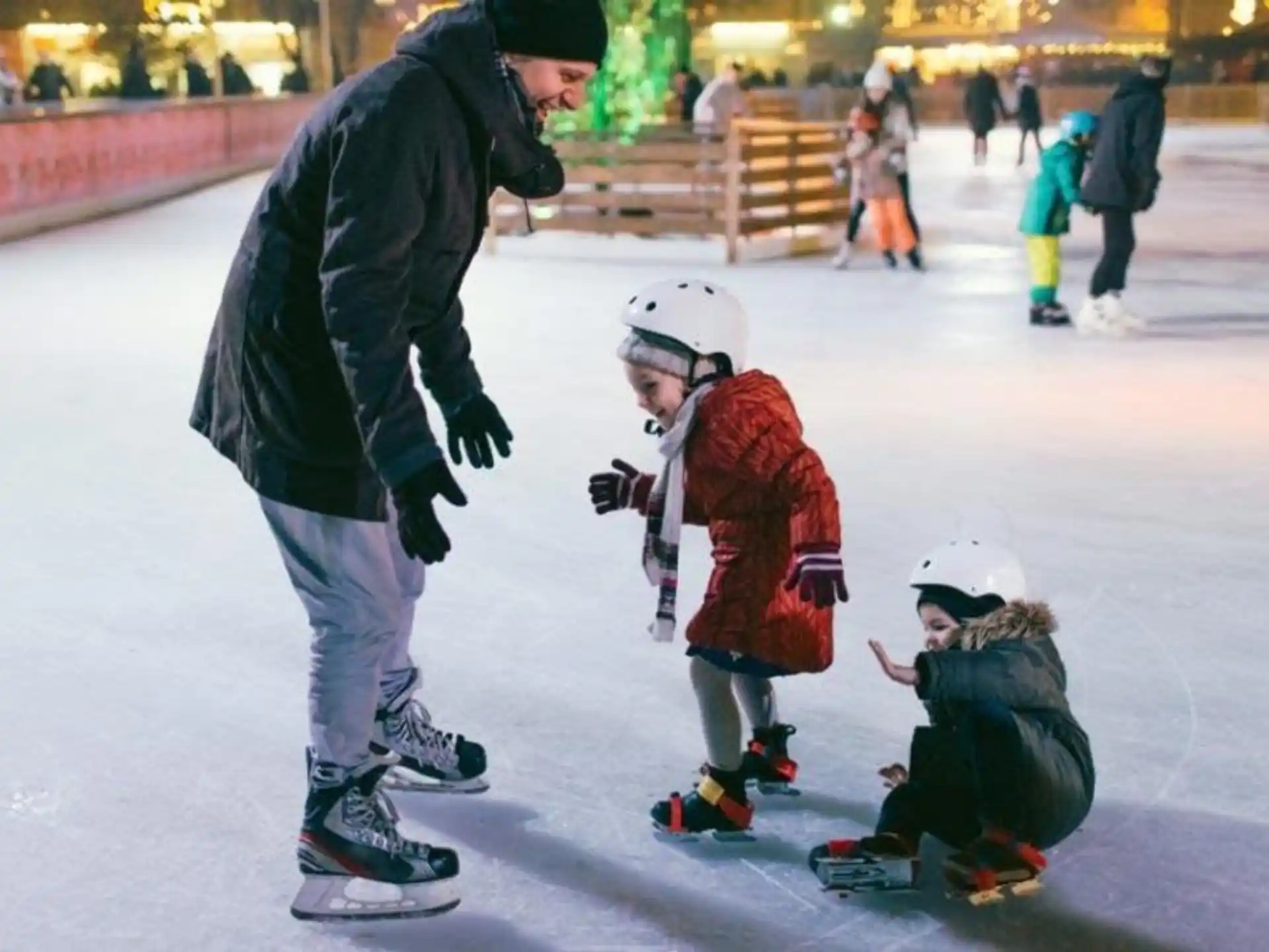 a person and a child on ice skates