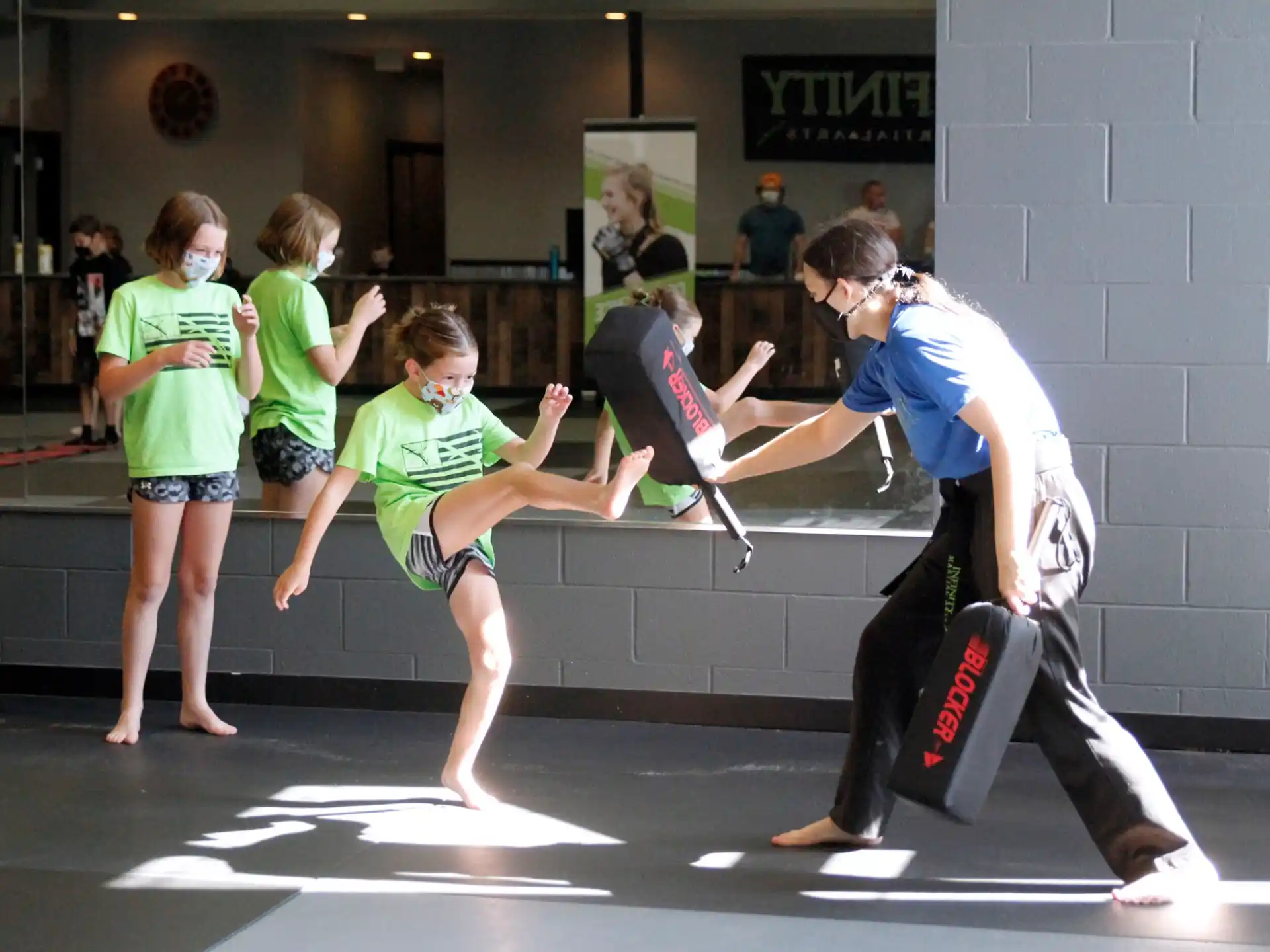 a group of children playing in a gym