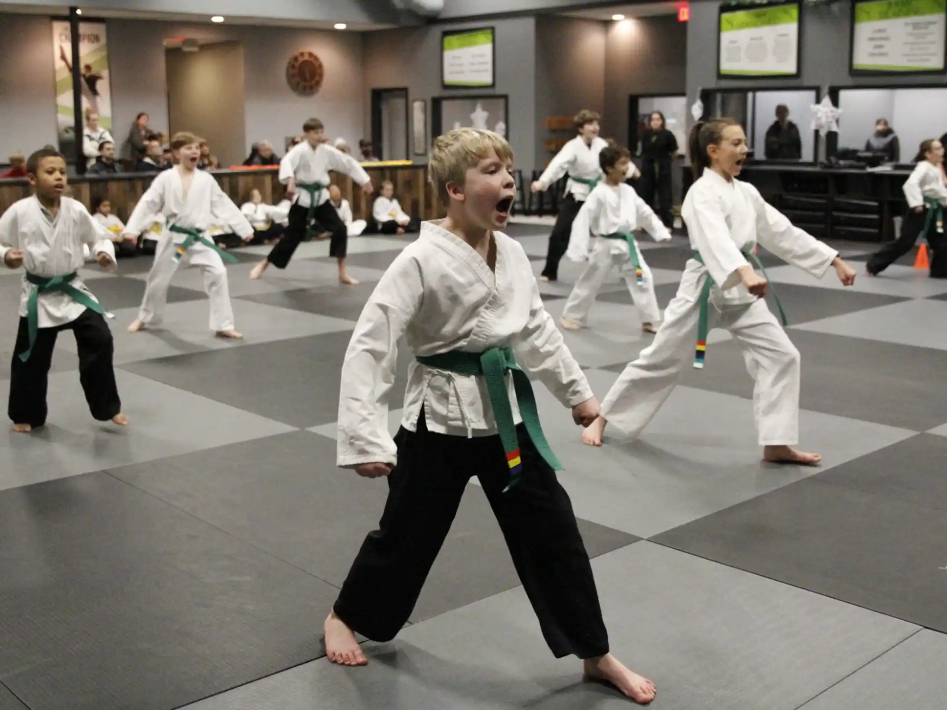 a group of people in karate uniforms
