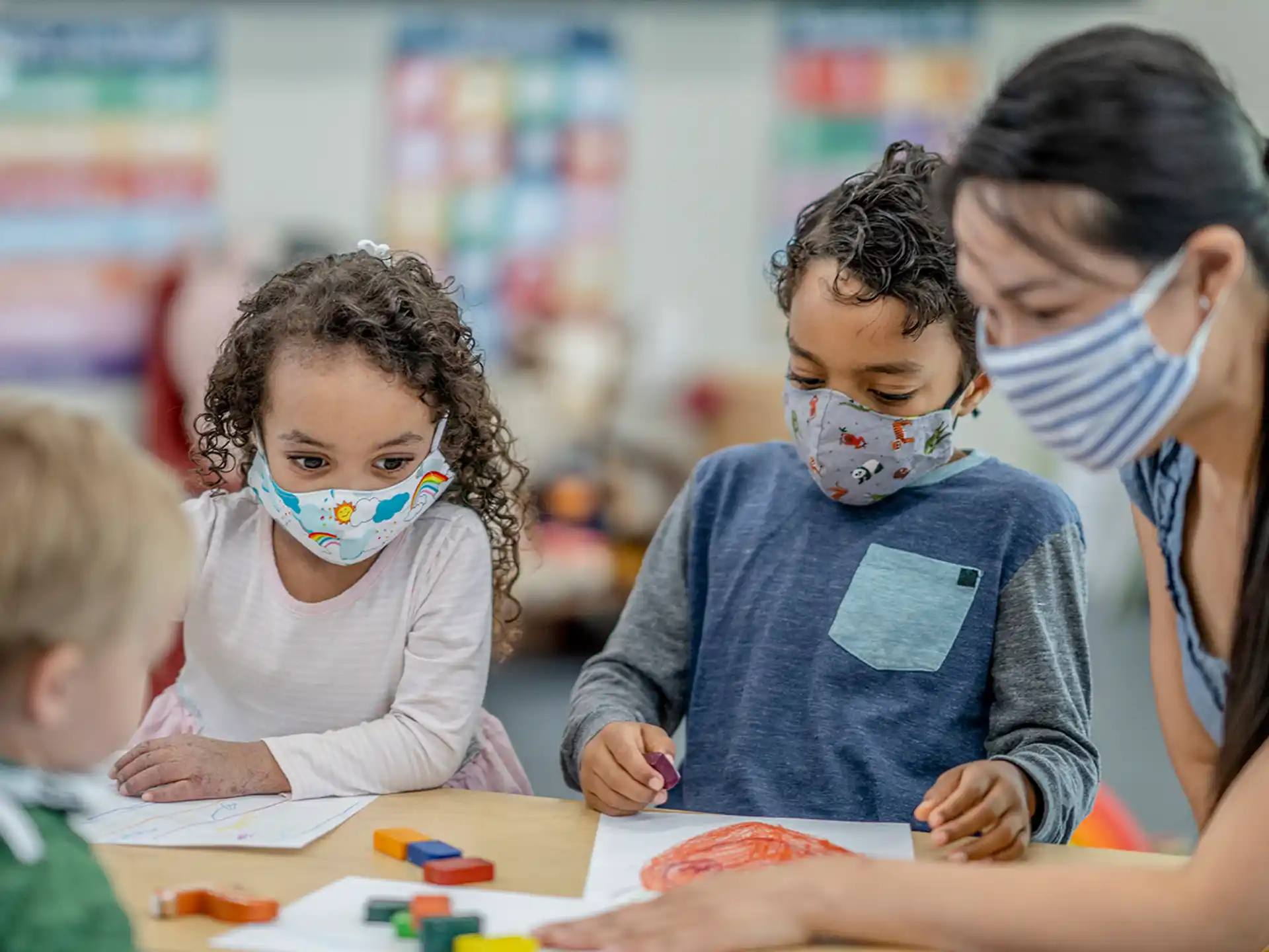 a group of children wearing face masks
