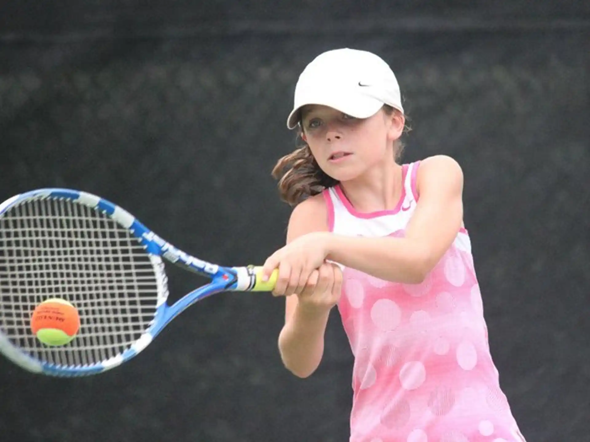 a girl playing tennis