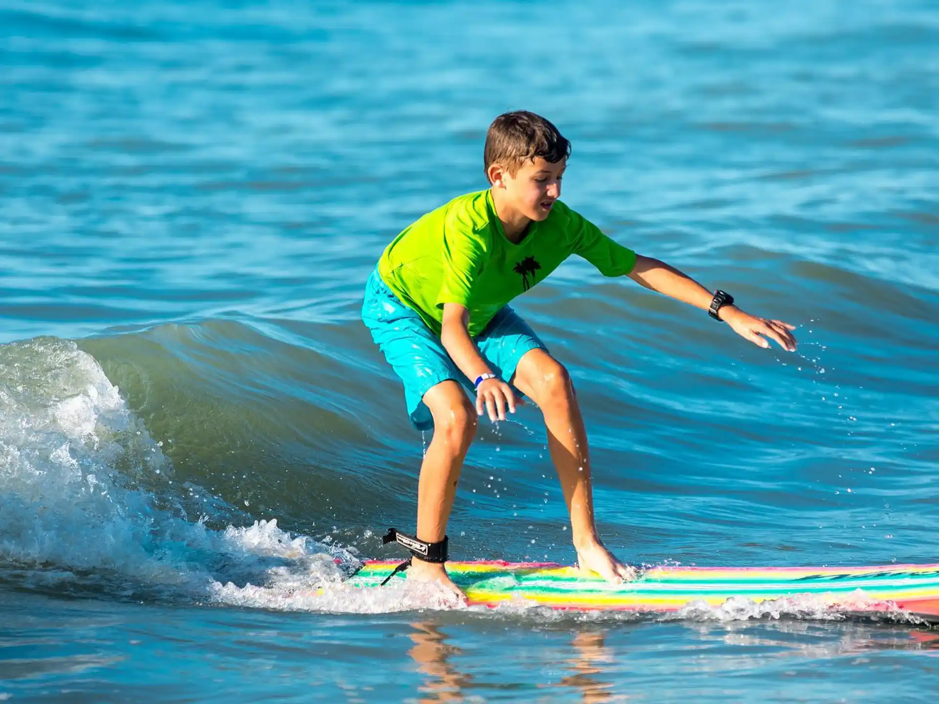 a boy surfing on the waves