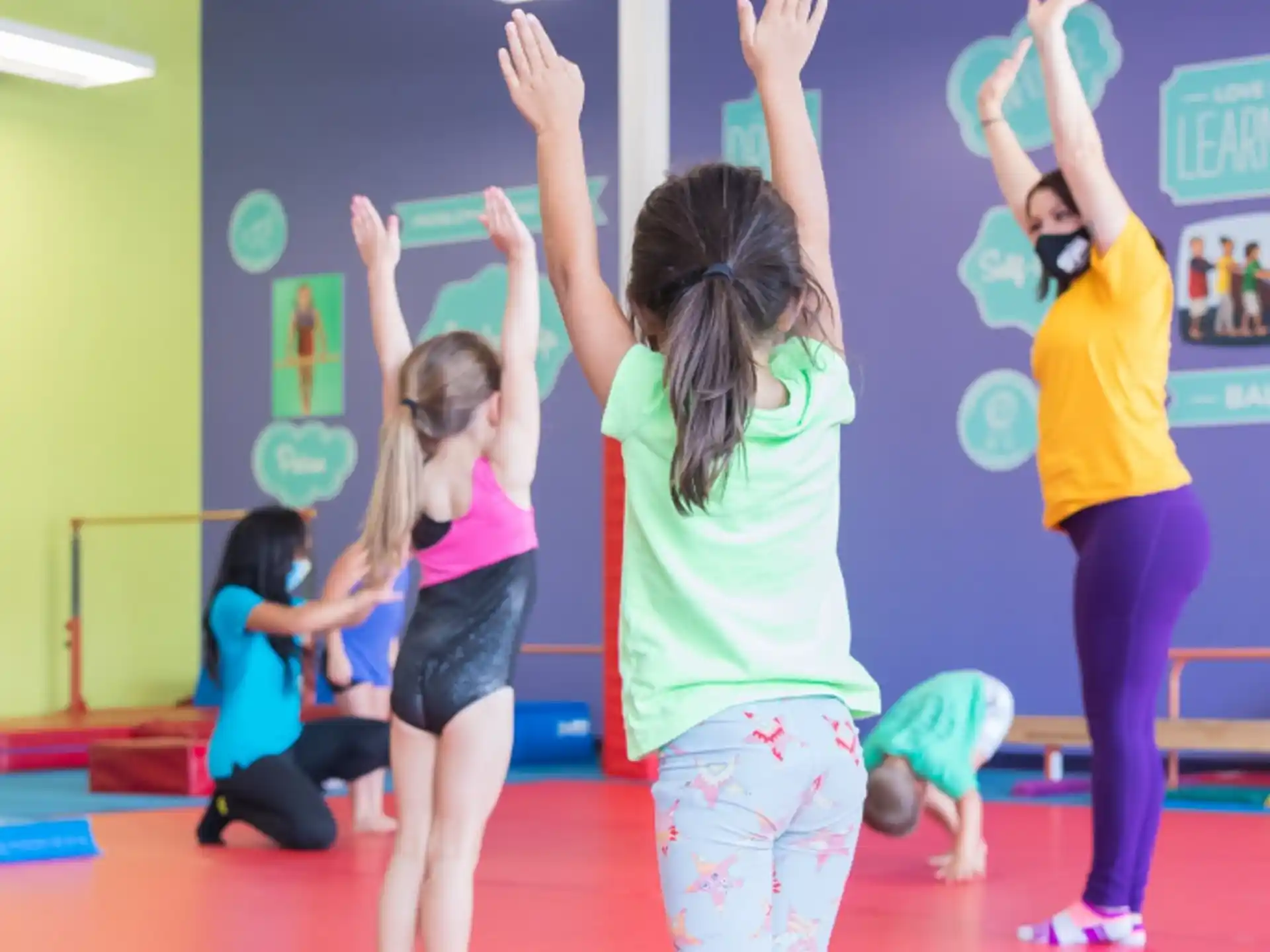 a group of girls doing yoga