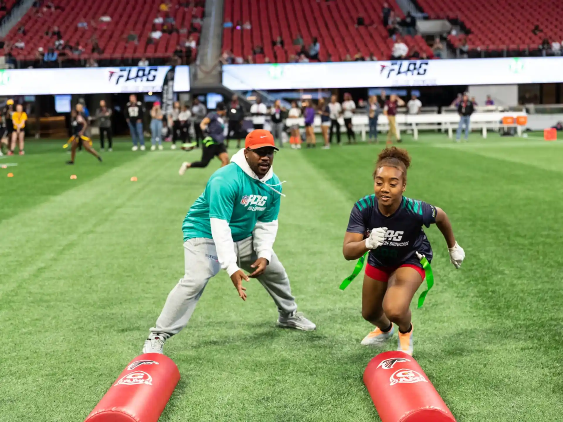 a person running towards a person in a sports uniform