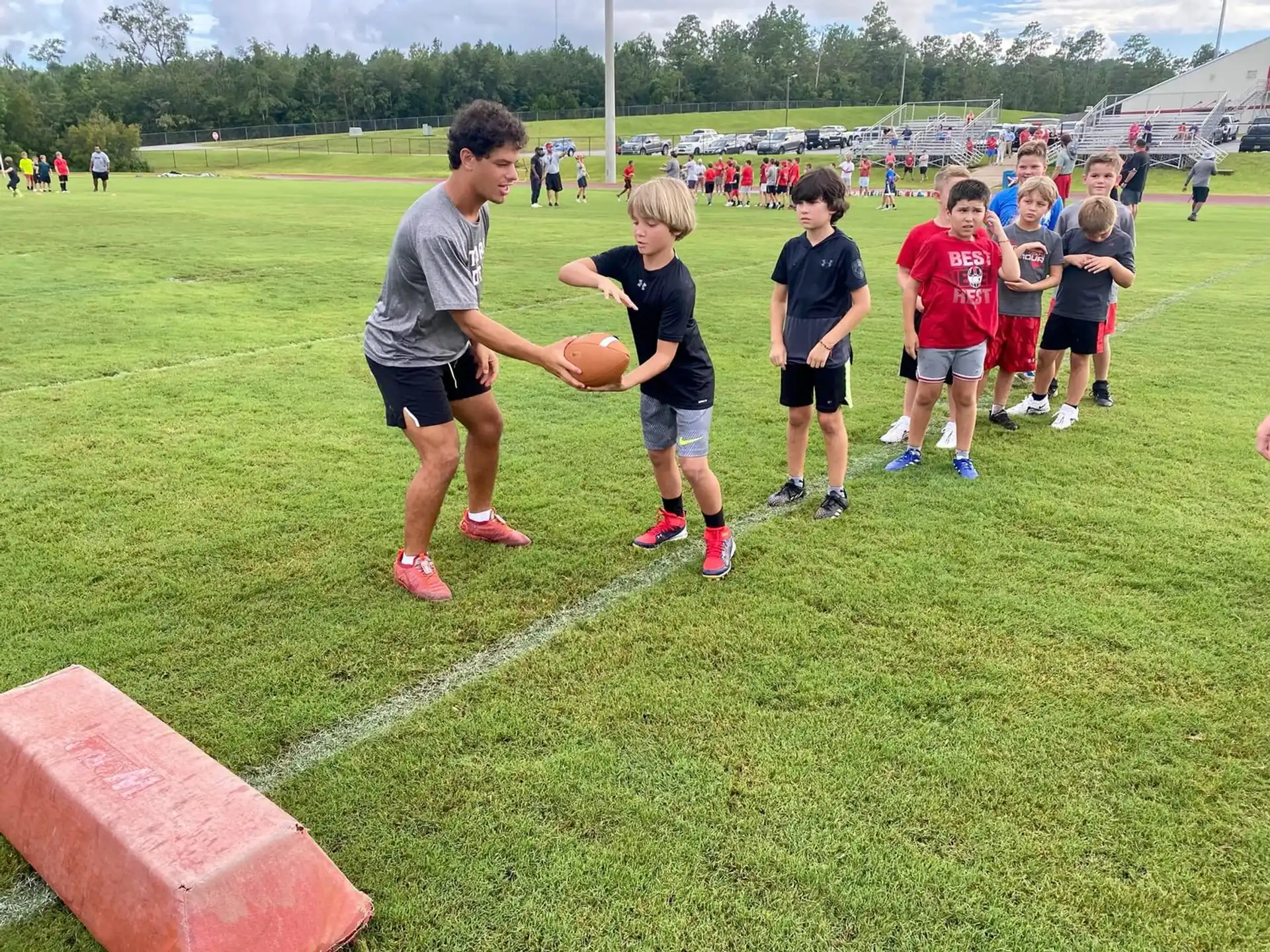 a group of kids playing football