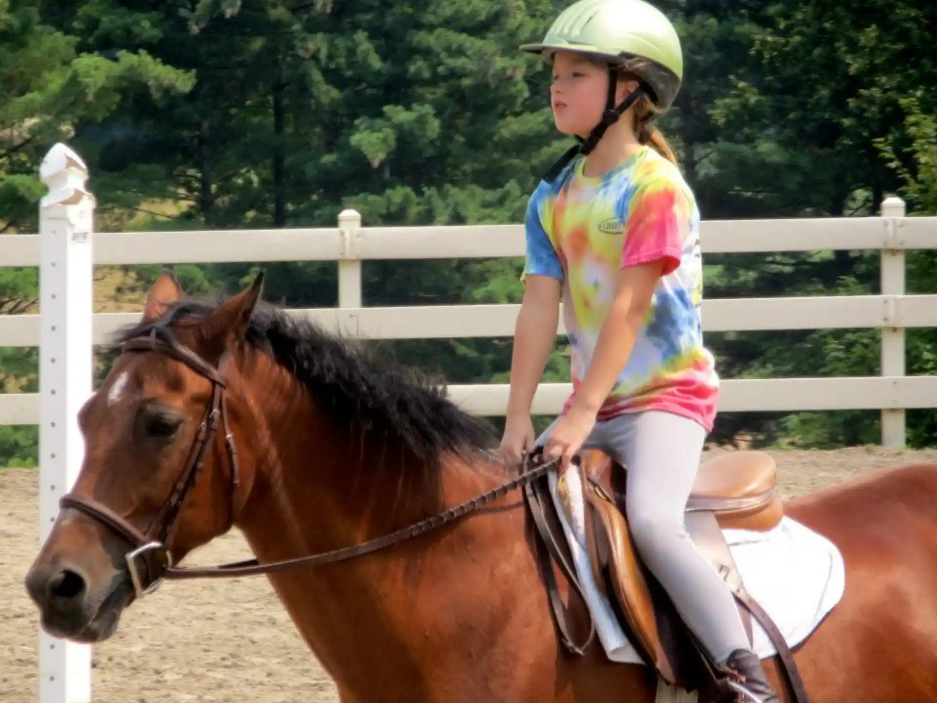 a girl riding a horse