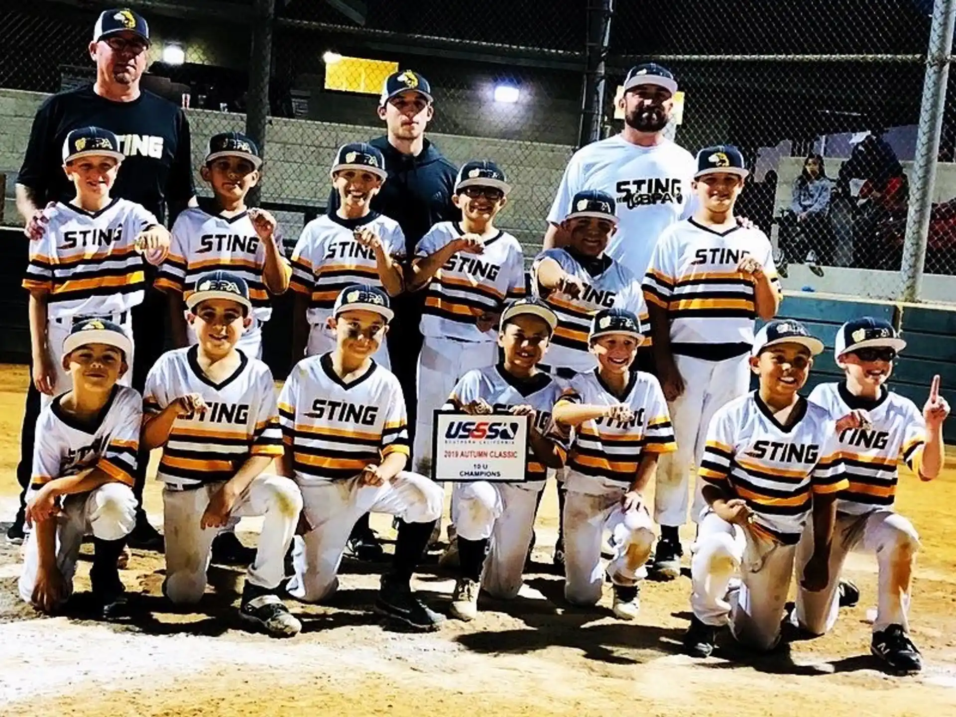 a group of baseball players posing for a photo
