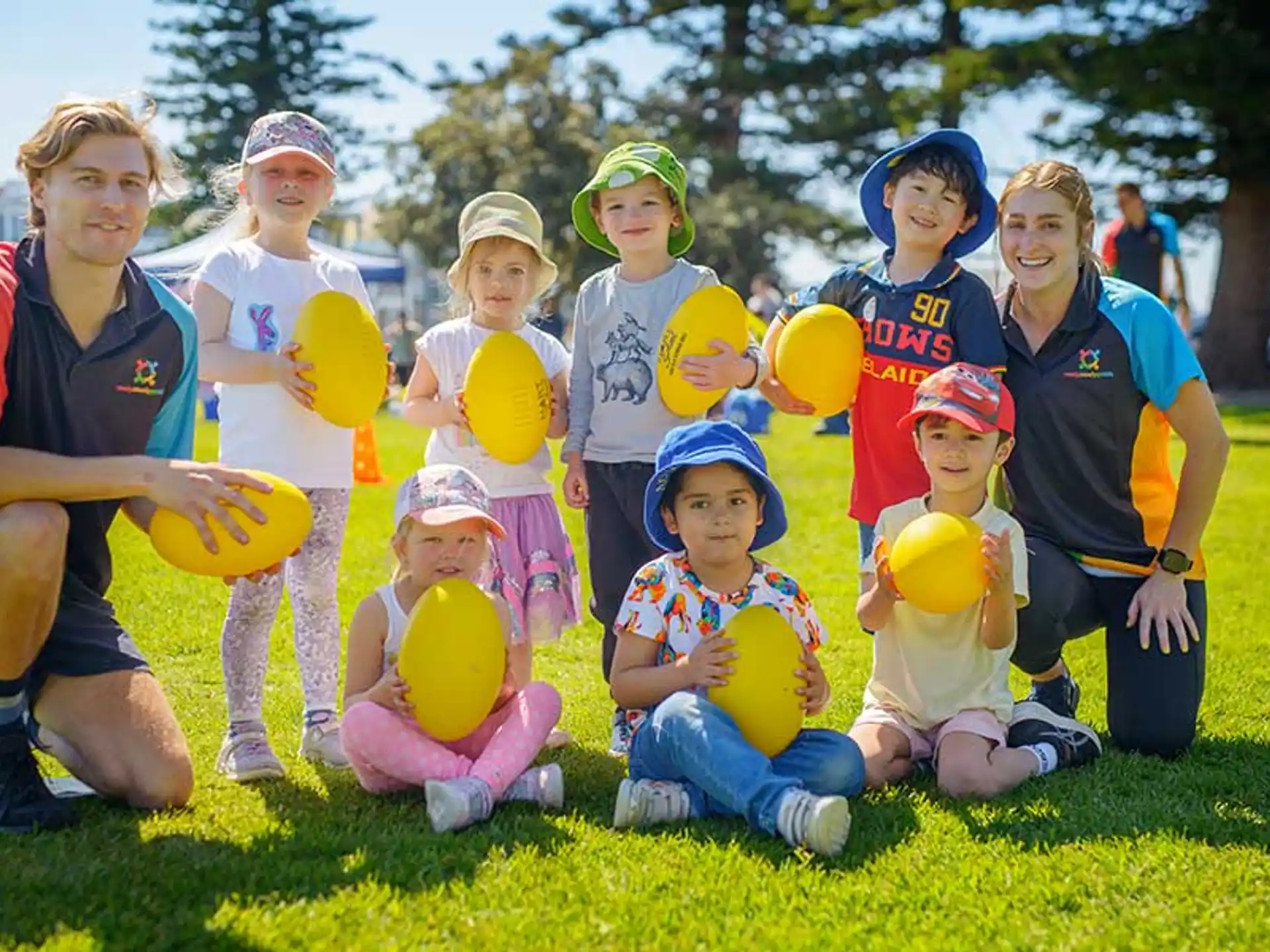 a group of kids holding balloons
