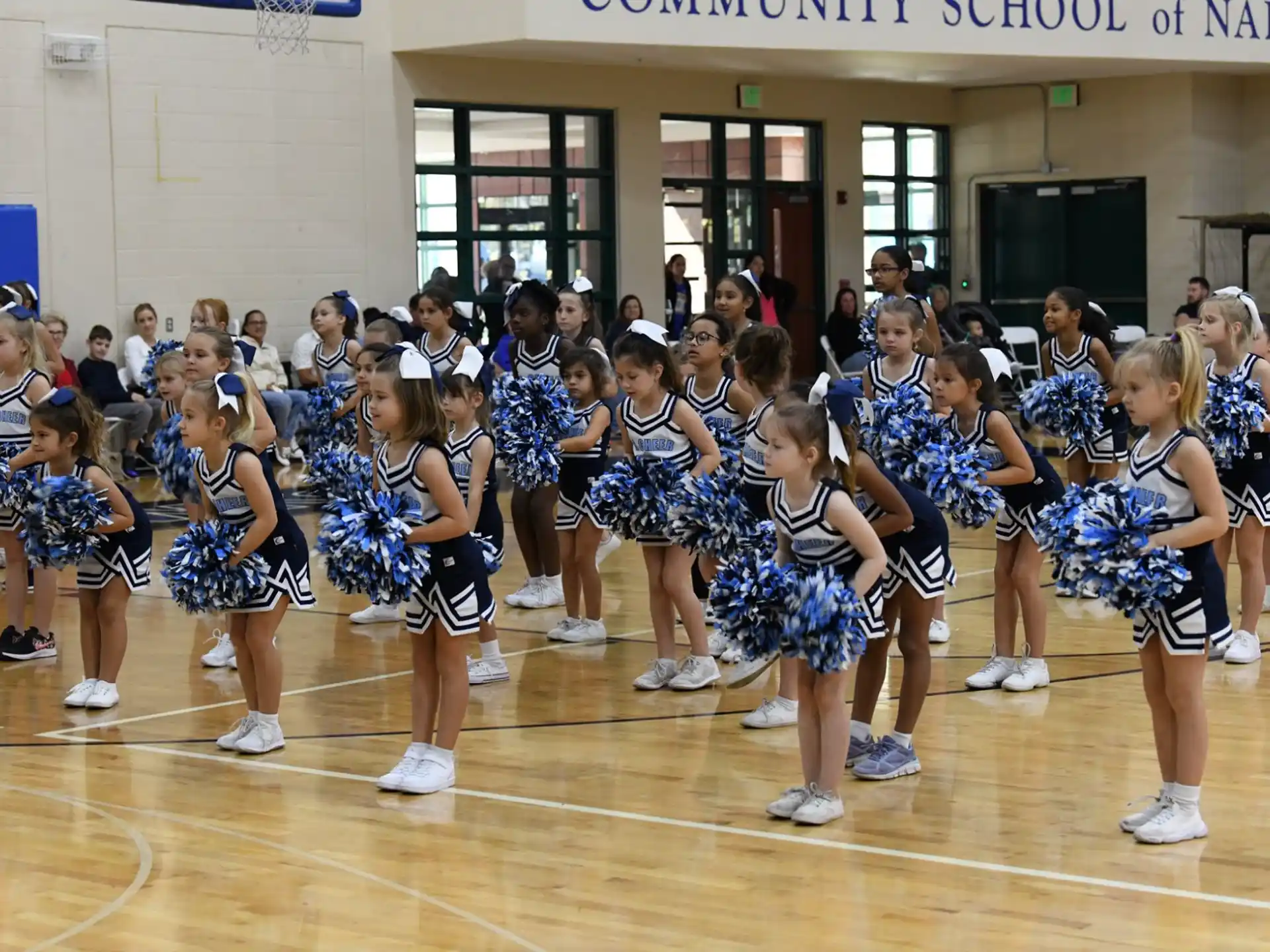 a group of cheerleaders in a gym