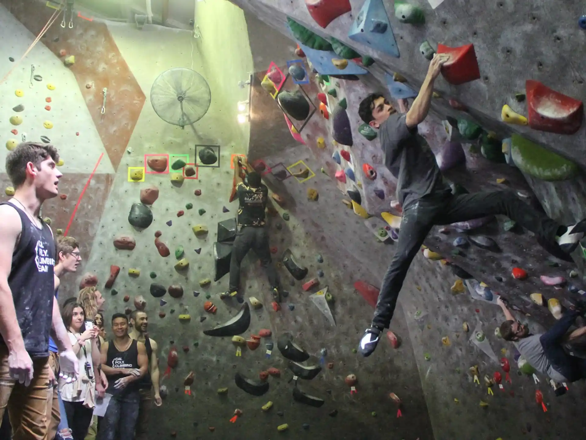 a man climbing a rock wall