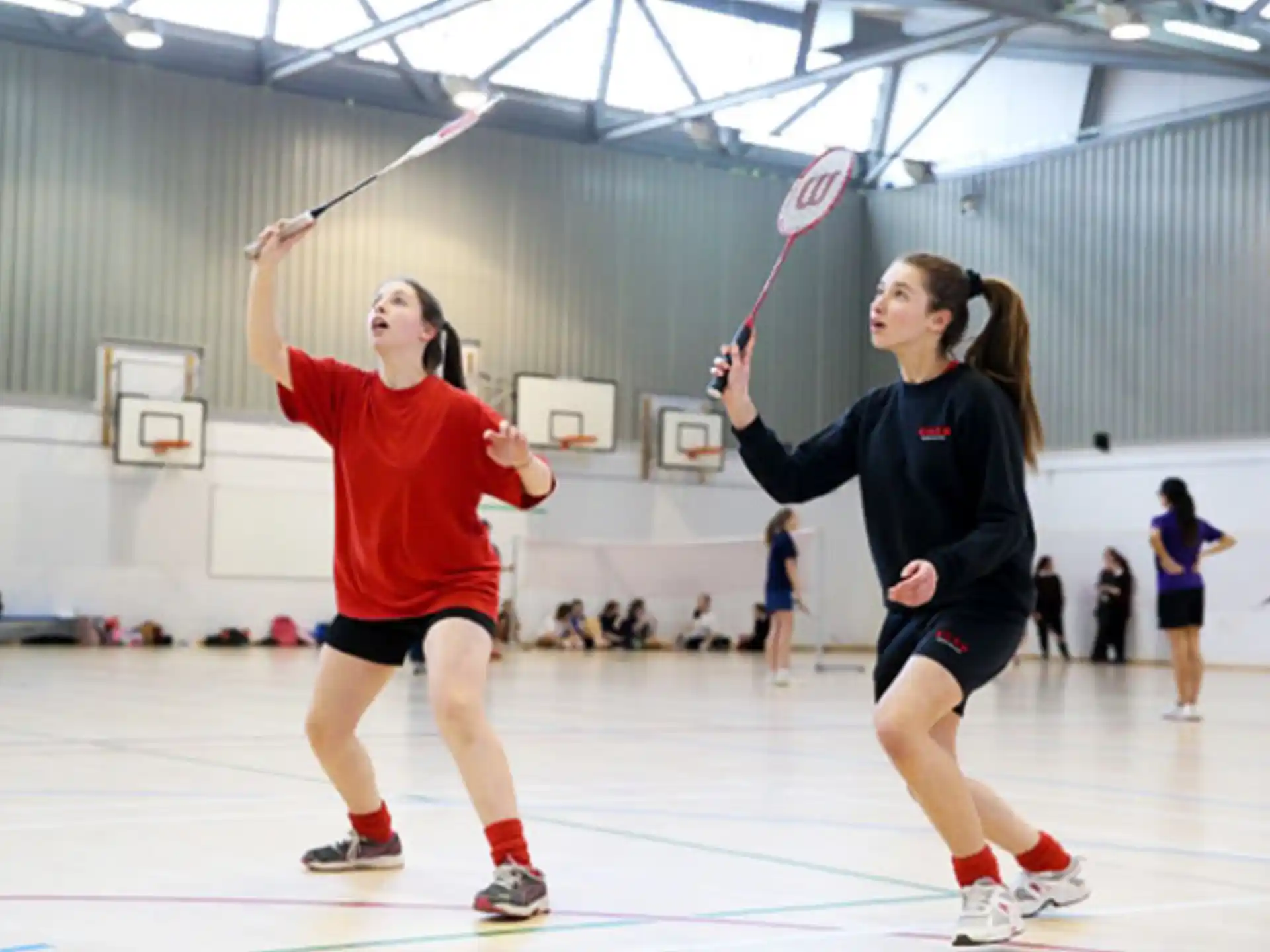 a couple of women playing hockey