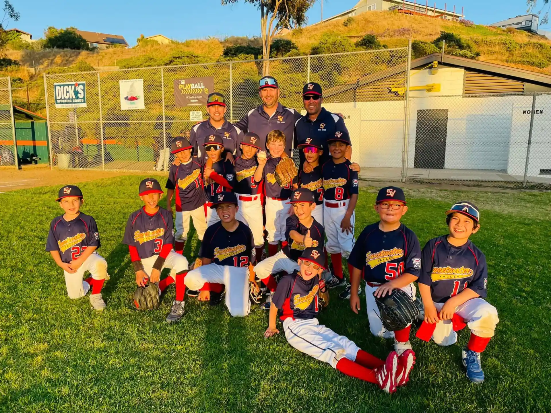 a group of baseball players posing for a photo