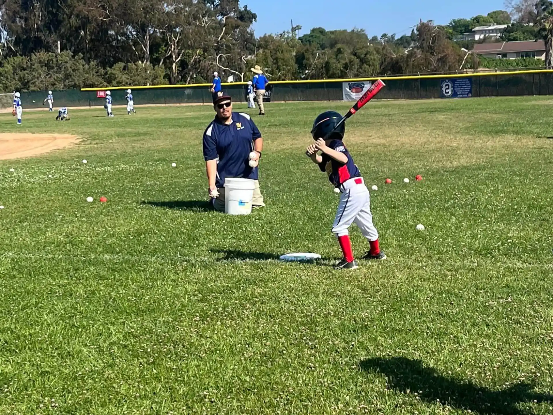a kid swinging a baseball bat