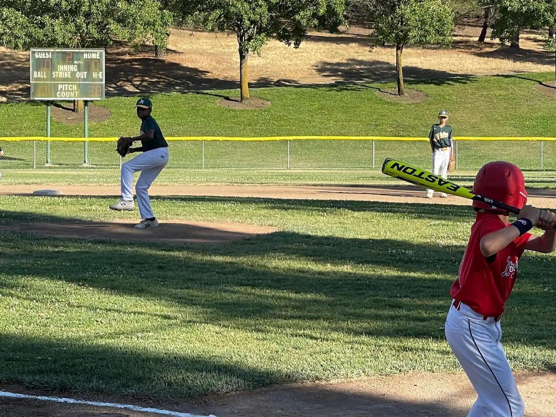 a baseball player prepares to swing a bat
