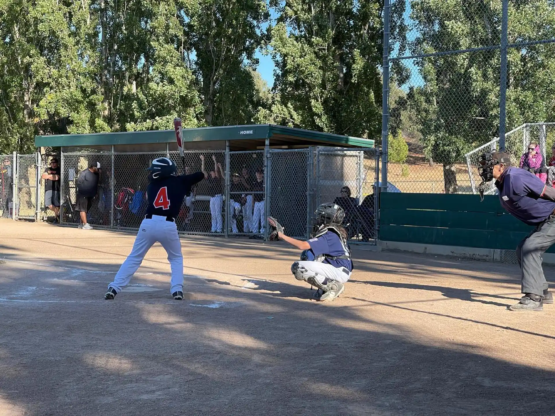a baseball player sliding into home plate