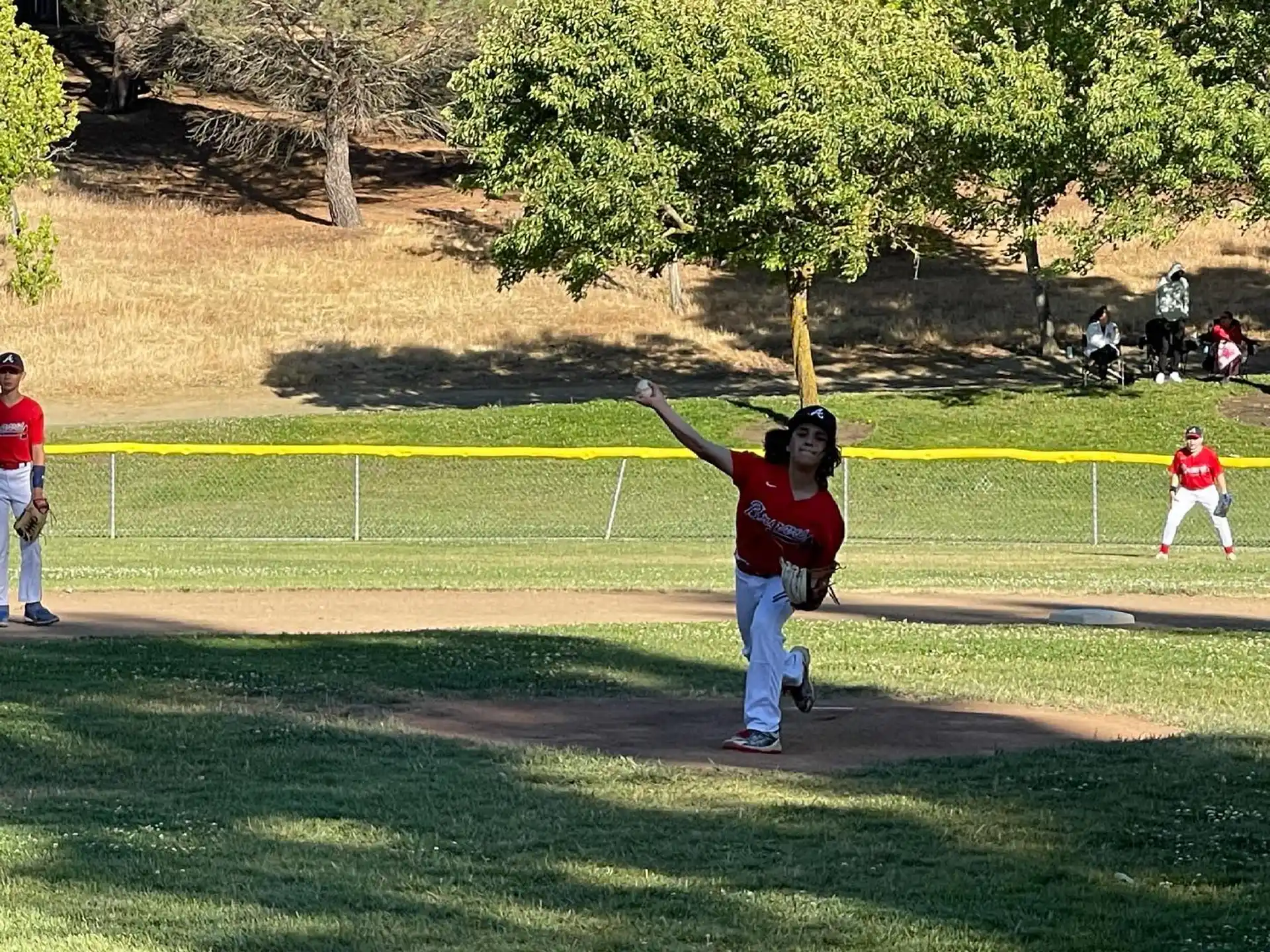 a kid throwing a baseball