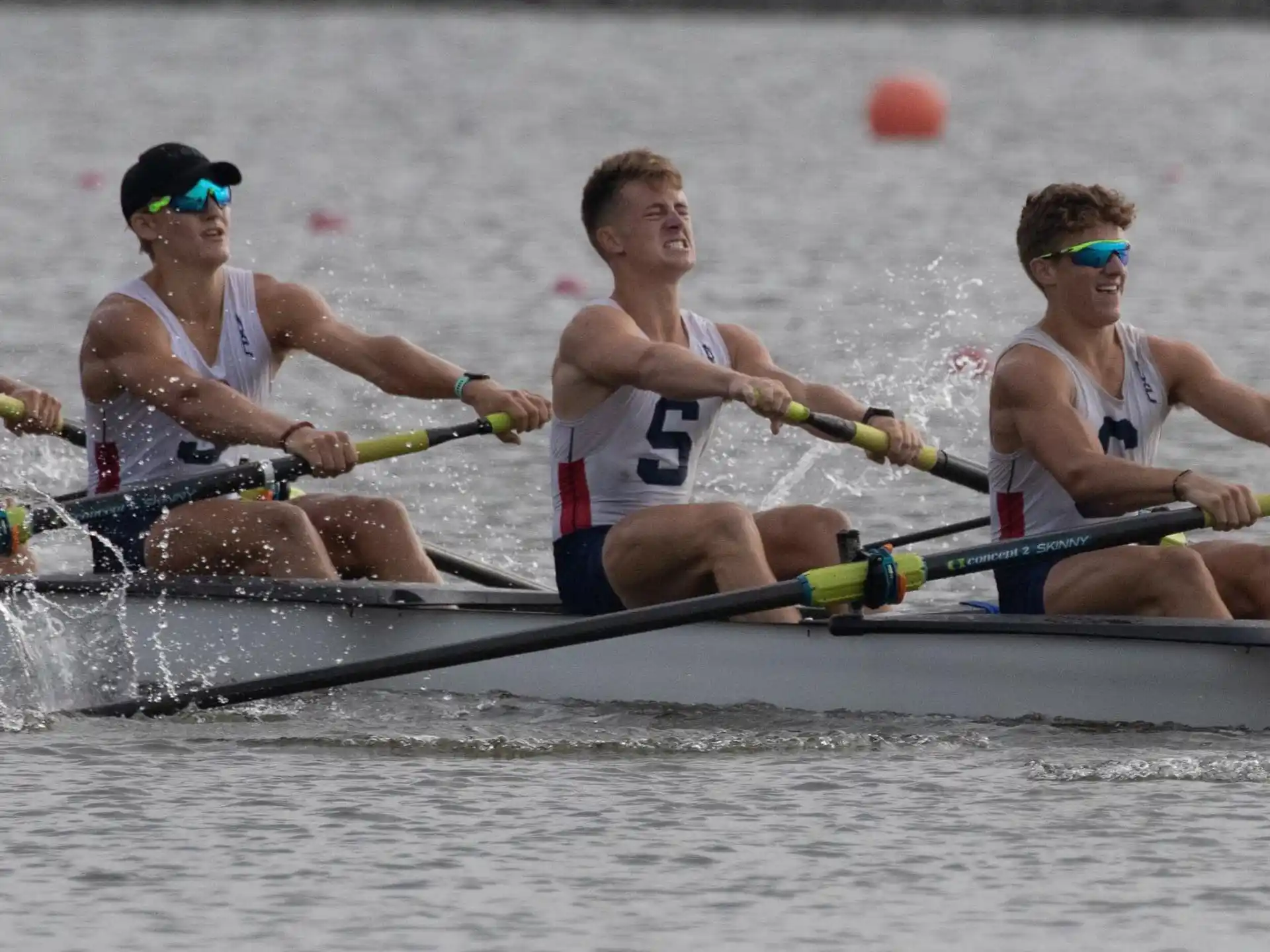 a group of people rowing a boat
