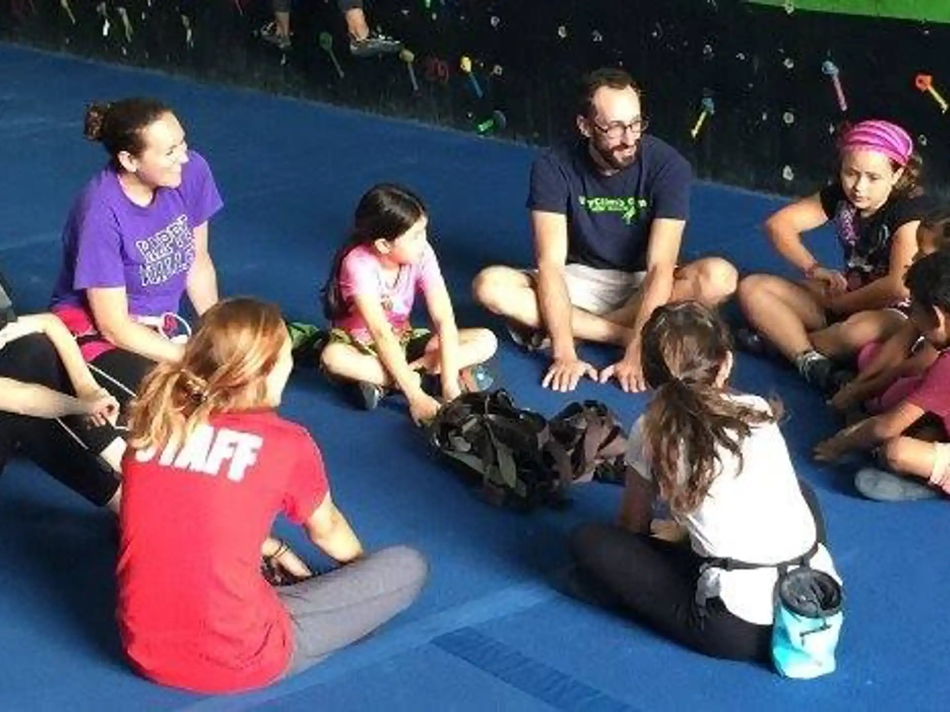 a group of people sitting on the floor