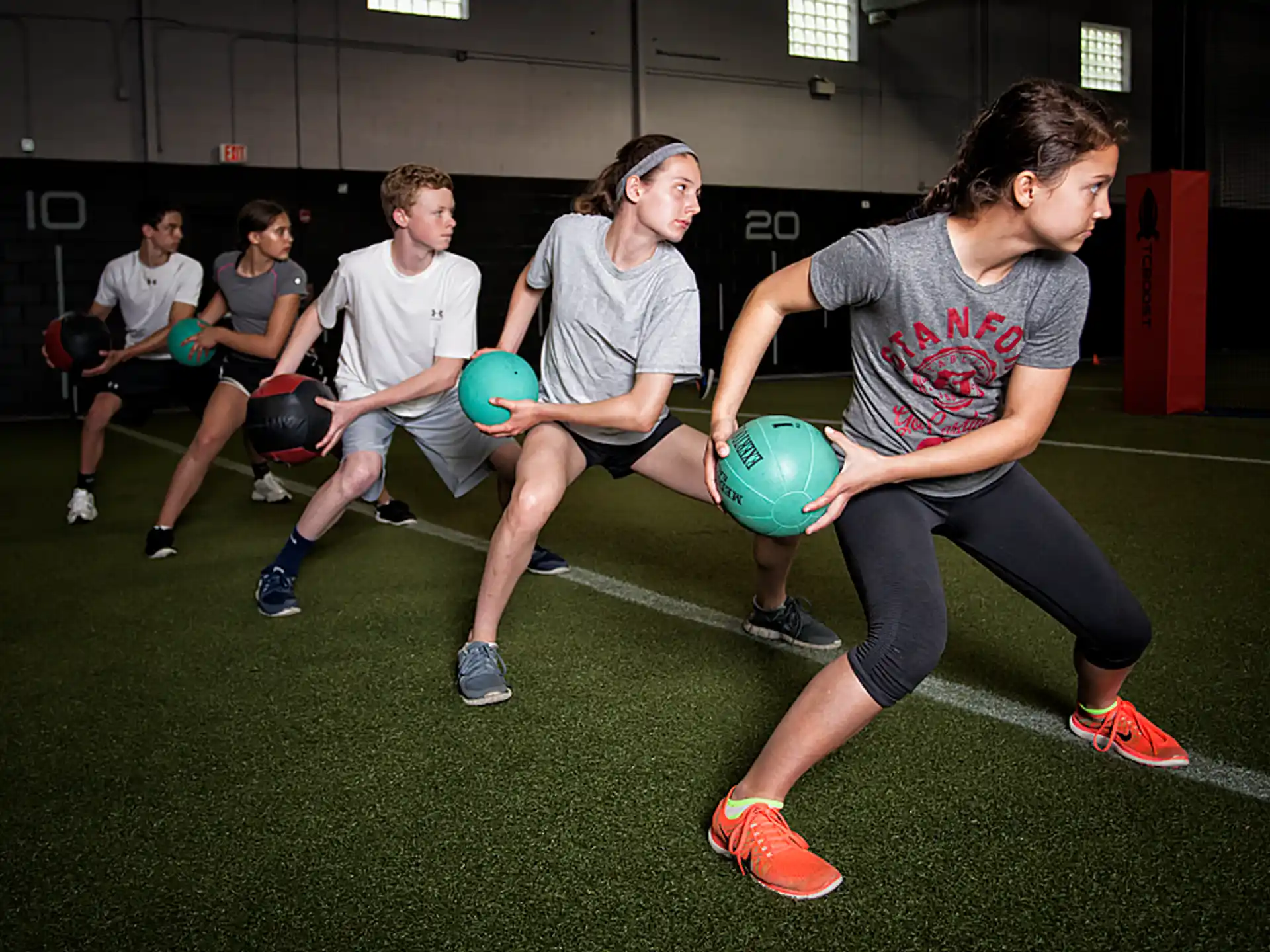 a group of people playing with balls