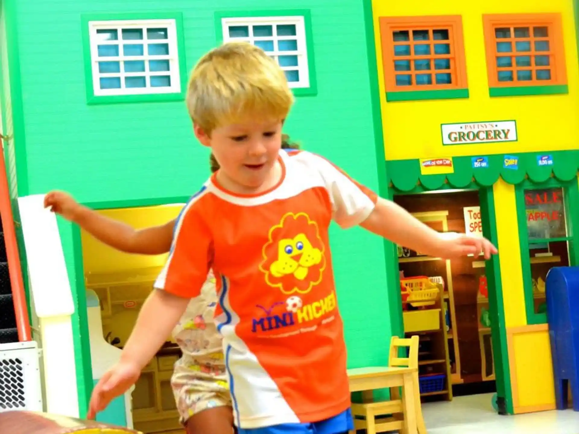 a boy in a yellow shirt