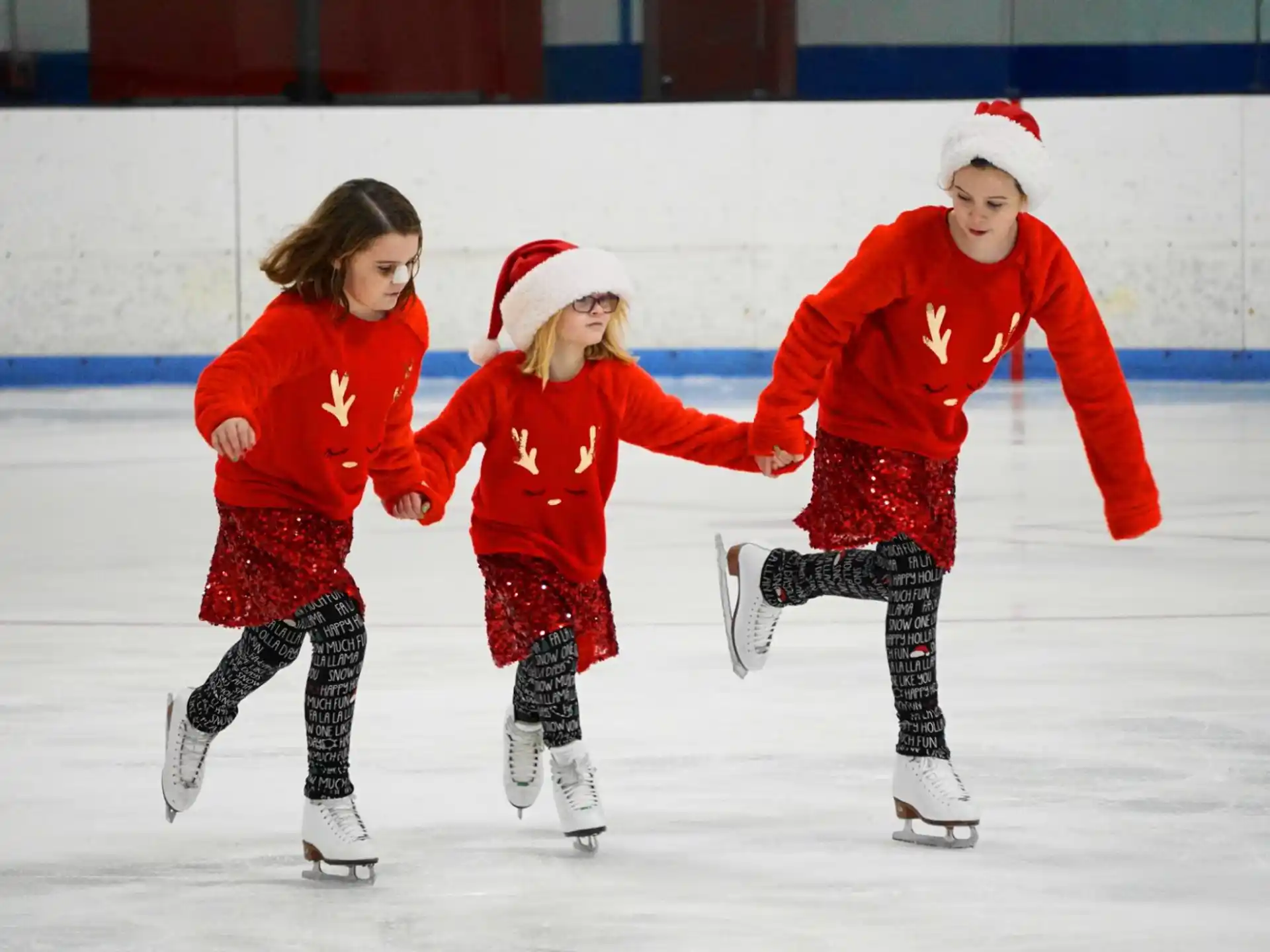 a group of children ice skating