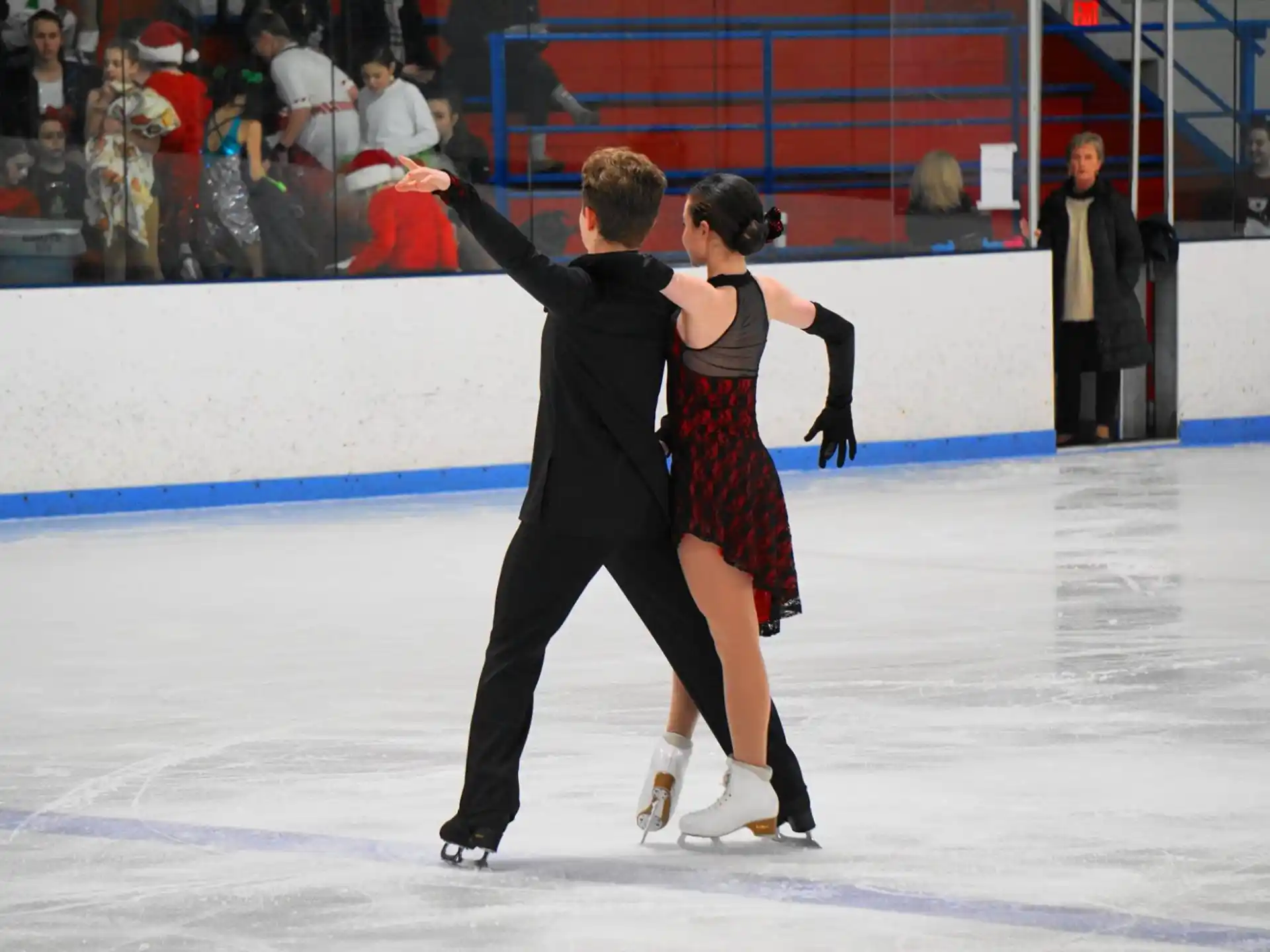 a man and woman ice skating
