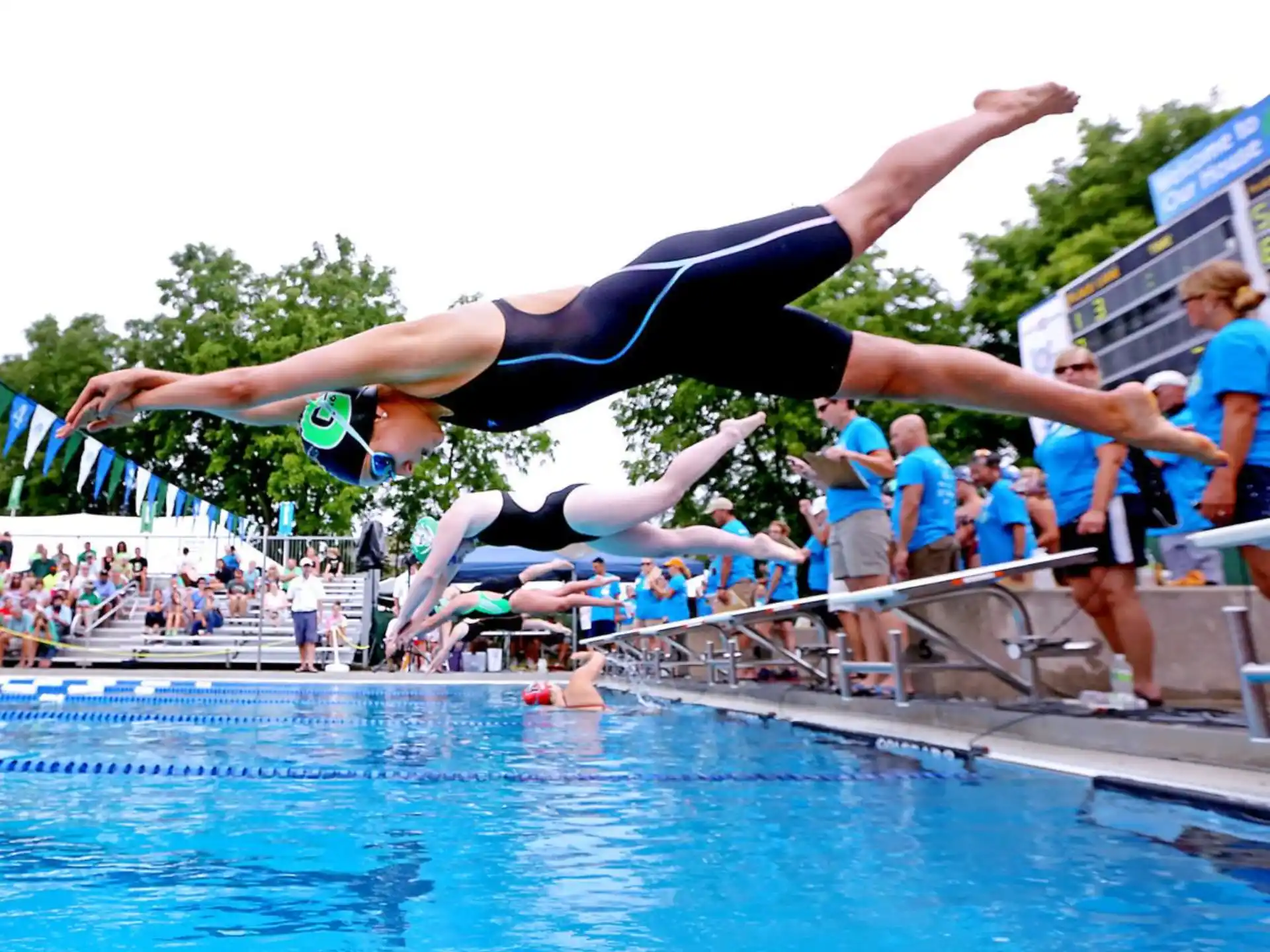 a person diving into a pool